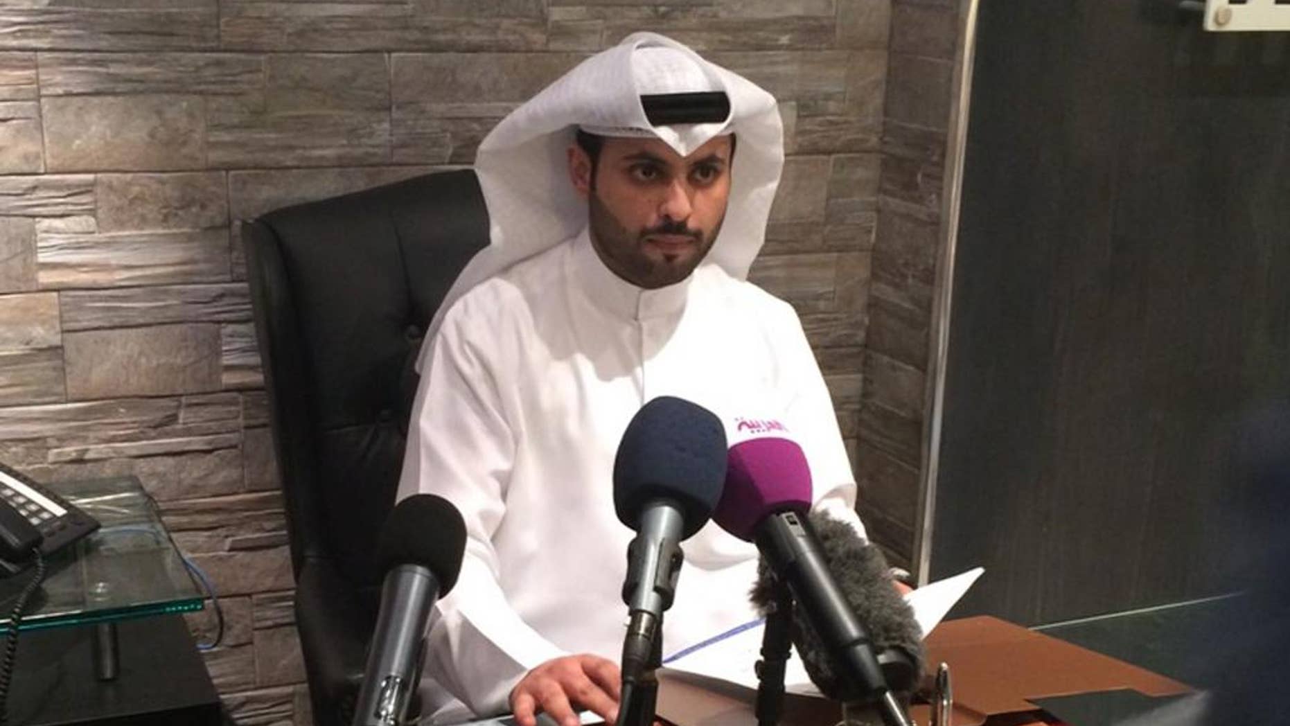 Kuwaiti lawyer Salem al-Hashash talks to reporters in his office in Kuwait City on Sunday, March 8, 2015. The former lawyer for the father of Mohammed Emwazi, unmasked as "Jihadi John" last month, said there is no evidence proving the masked Islamic State militant is his client's son. (AP Photo/Hussain al-Qatari)