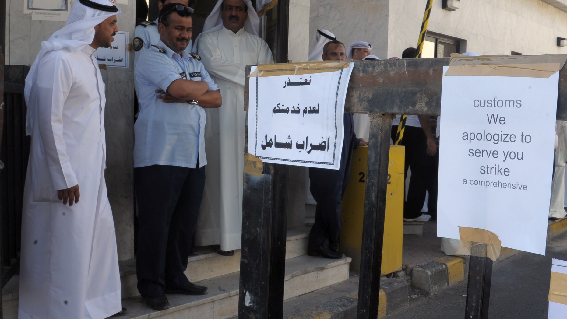 Employees of Kuwait's Customs gather at the Cargo terminal in Kuwait Airport demanding better pay in Kuwait, Monday, Oct. 10, 2011.