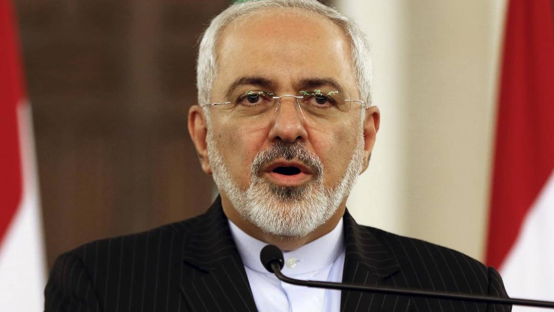 Iranian Foreign Minister Mohammad Javad Zarif speaks during a press conference at the government palace in Beirut, Lebanon, Tuesday, Aug. 11, 2015. Zarif is holding talks with Lebanese officials before proceeding on to Damascus, Syria. (AP Photo/Bilal Hussein)