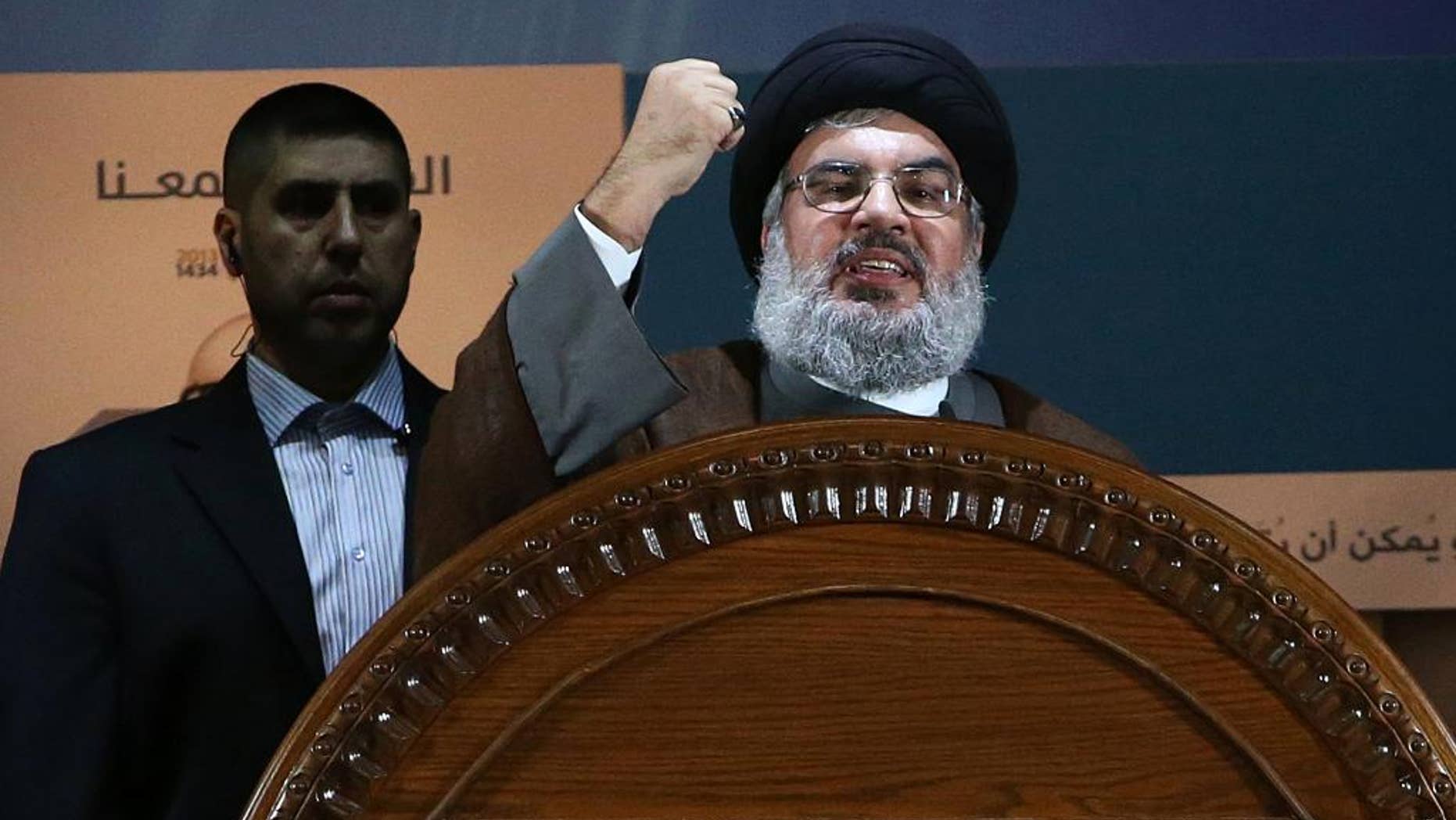 FILE - In this August 2, 2013, file photo, Hezbollah leader Sheik Hassan Nasrallah speaks during a rally to mark Jerusalem day, or Al-Quds day, in the southern suburb of Beirut, Lebanon. The government of Syrian President Bashar Assad is no longer in danger of falling, Nasrallah, the leader of Lebanon's militant Hezbollah group, said in interview with Lebanon's daily As-Safir newspaper published Sunday, April 6, 2014. (AP Photo/Hussein Malla, File)