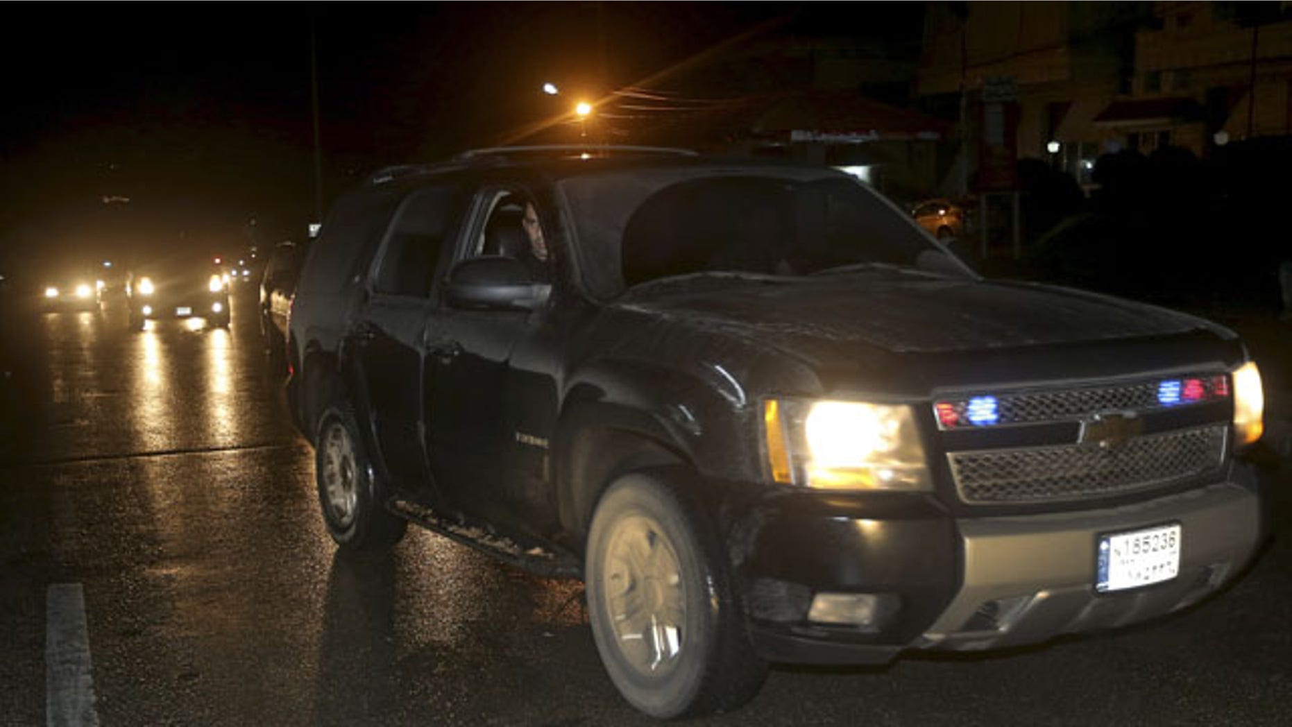 March 10, 2014: An official Lebanese security convoy carrying a group of released nuns arrives at the Lebanese border crossing point of Masnaa, eastern Bekaa valley, Lebanon. The release of the nuns and their helpers, 16 women in all, is a rare successful prisoner-exchange deal between Syrian government authorities and the rebels seeking to overthrow the rule of President Bashar Assad. (AP Photo/Hussein Malla)
