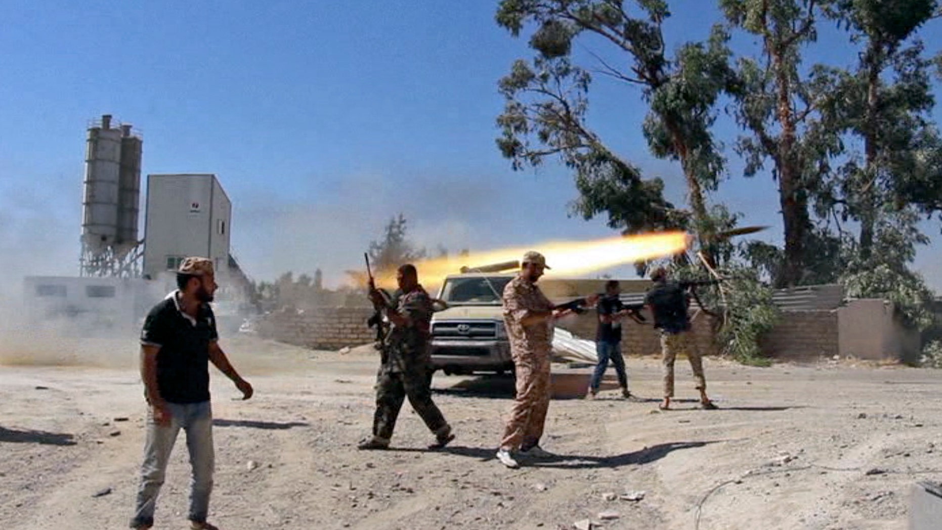 July 26, 2014 - Fighters from the Islamist Misarata brigade fire towards Tripoli airport in an attempt to wrest control from a powerful rival militia, in Tripoli, Libya. The battle for control of Tripoli's international airport began 2 weeks ago when Islamist-led militias launched a surprise assault on the airport, under control of rival militias. (Frame grab from video obtained from a freelance journalist traveling with the Misarata brigade)