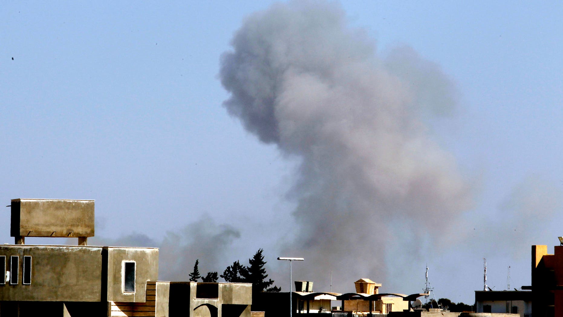 April 14: Smoke rise from an area in southeast Tripoli, Libya, soon after a blast (AP)