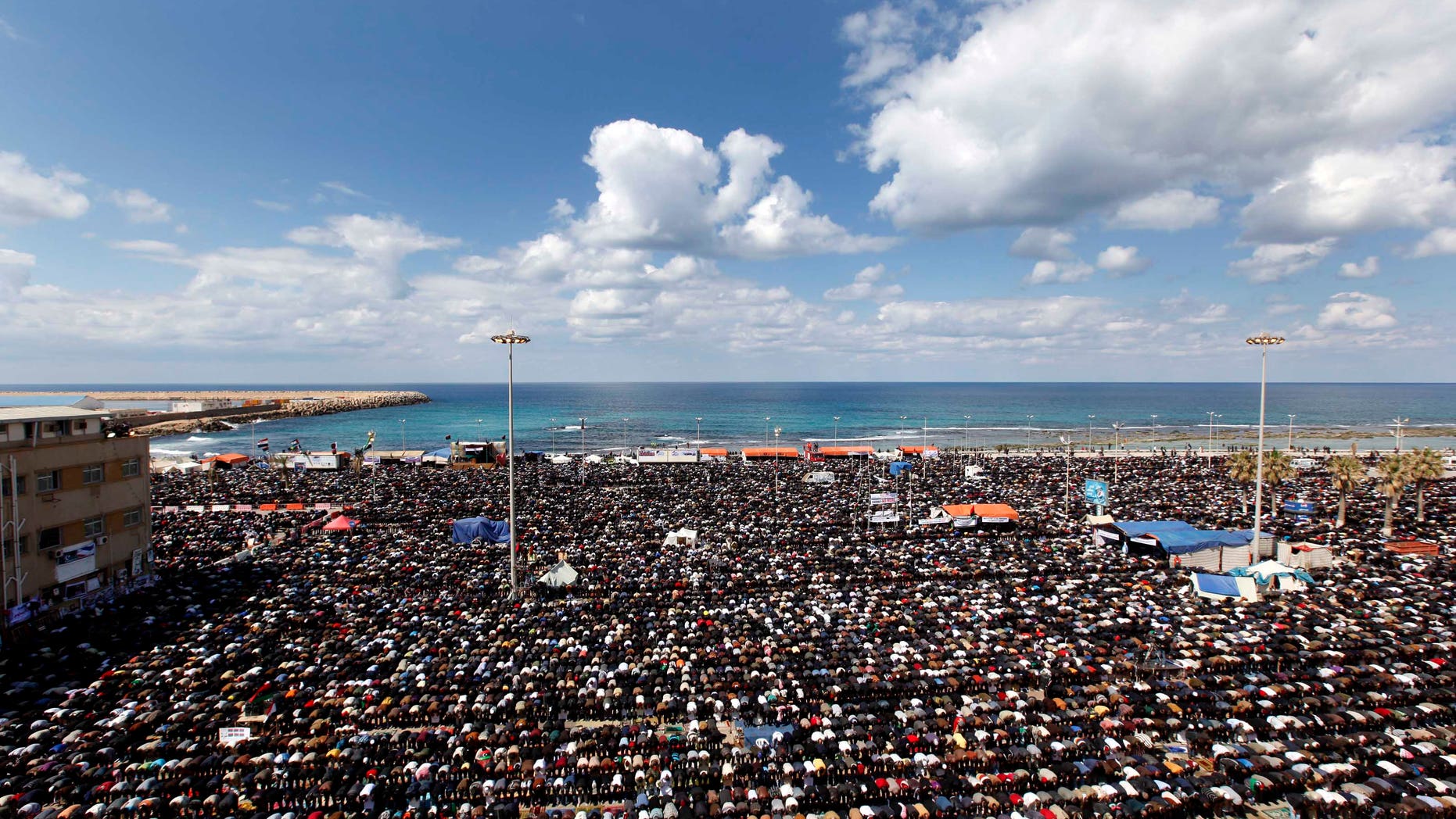 March 11: Anti-Libyan Leader Muammar Qaddafi protesters pray during the Friday prayer at the court square, in Benghazi, eastern Libya. (AP)