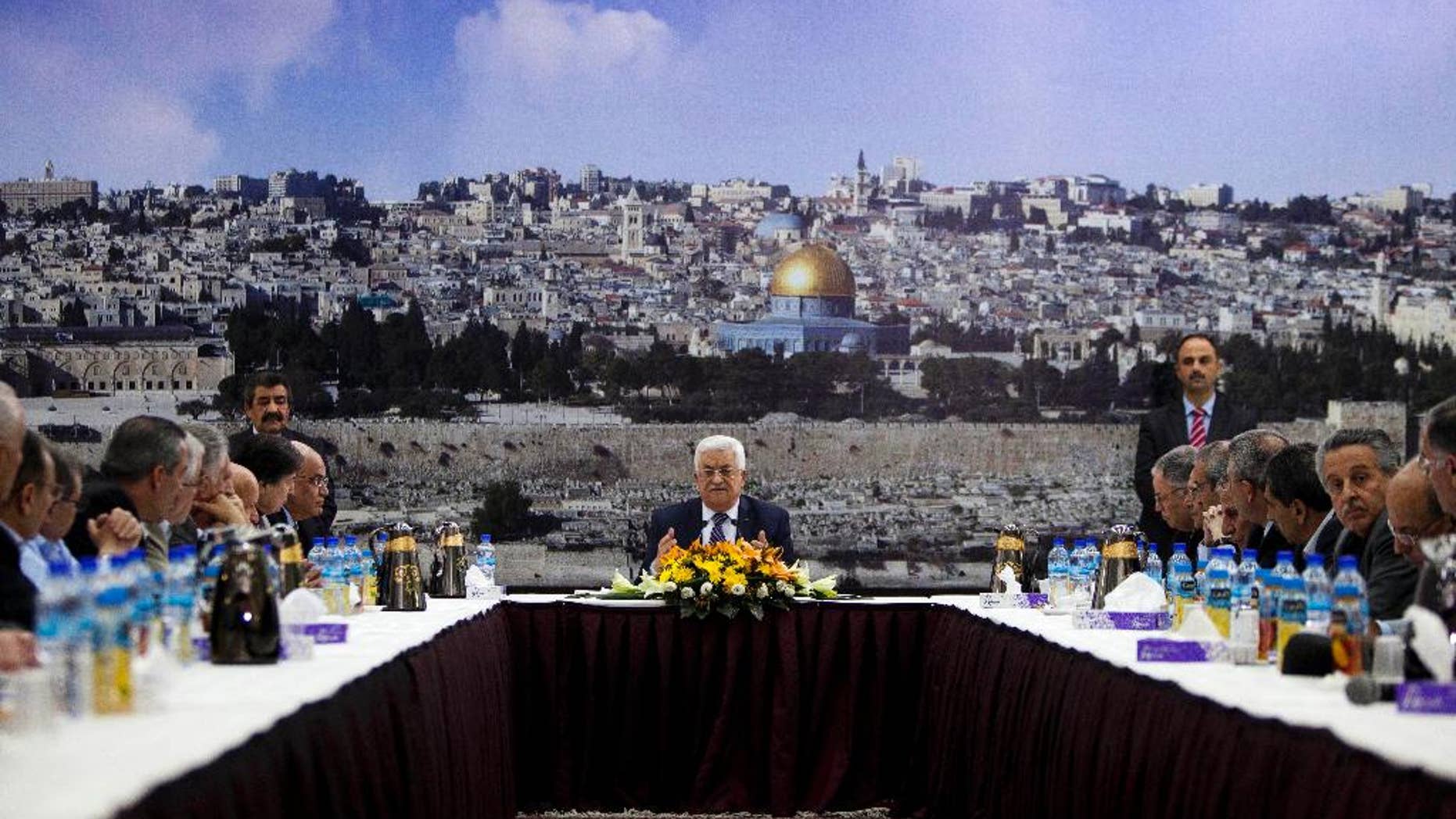 FILE - In this April 1, 2014 file photo Palestinian President Mahmoud Abbas talks during a leadership meeting in Ramallah. The examples from recent weeks signal that disagreeing with Abbas and his inner circle comes at a price for Palestinians. Critics say that after a decade in power, Abbas has created an increasingly authoritarian system with little room for dissent. (AP Photo/Majdi Mohammed, File)