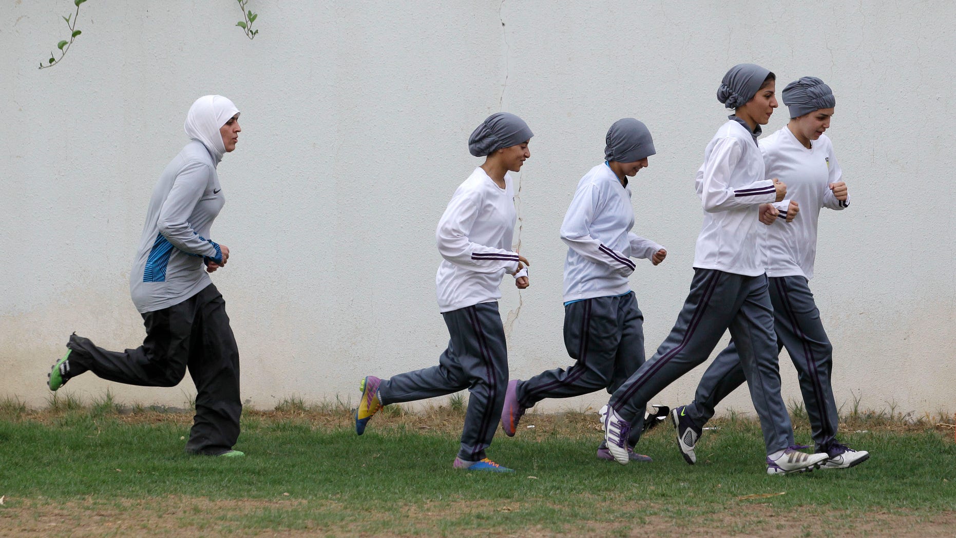 In this May 21, 2012 file photo, members of a Saudi female soccer team practice at a secret location in Riyadh, Saudi Arabia.
