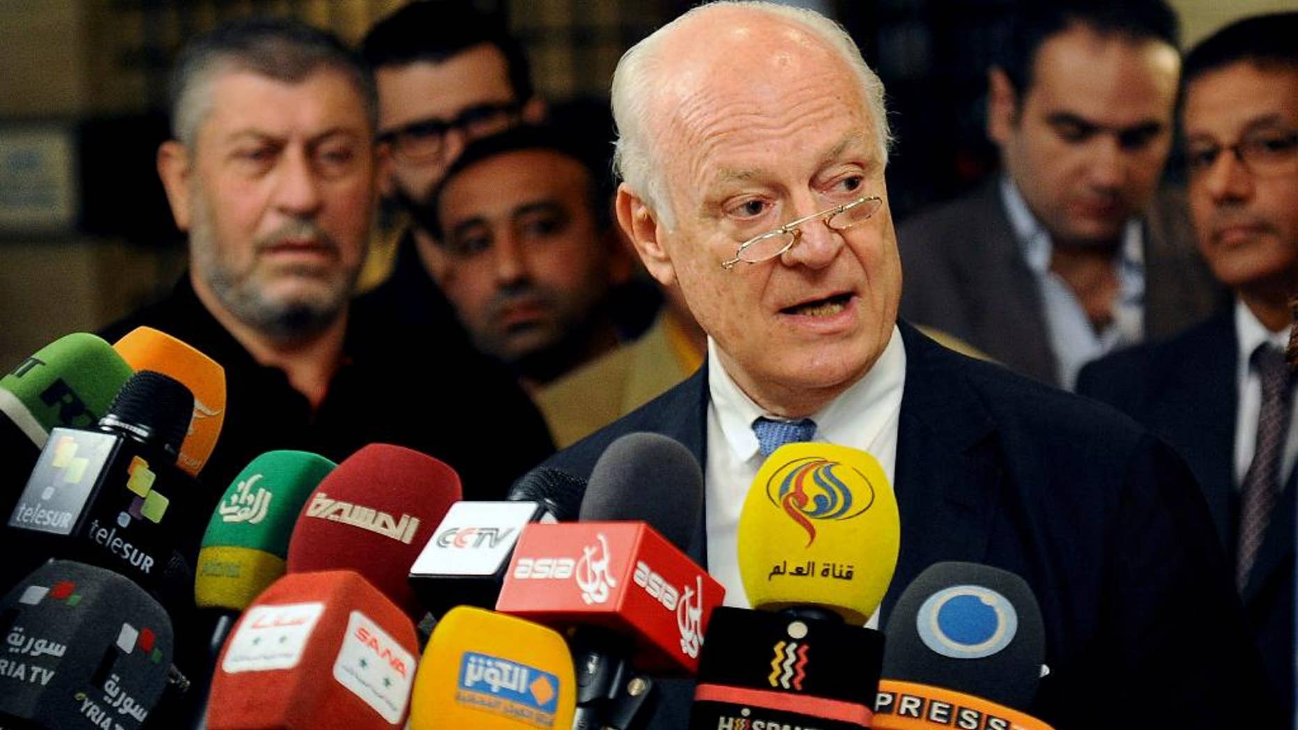 FILE - In this Sept. 11, 2013 file photo, Syrian Minister of National Reconciliation Ali Haidar speaks during an interview with The Associated Press in Damascus, Syria on Wednesday, Sept. 11, 2013. Haidar said Monday, Nov. 17, 204 in an interview with AP that Damascus has agreed "in principle" to the U.N. envoy Staffan de Mistura's call for local cease-fires to try to ease the worst fighting in the country's civil war, but that the government needs more details before it can make a final decision. De Mistura has called for an incremental truce in the northern city of Aleppo as a first step toward a wider peace. (AP Photo, File)