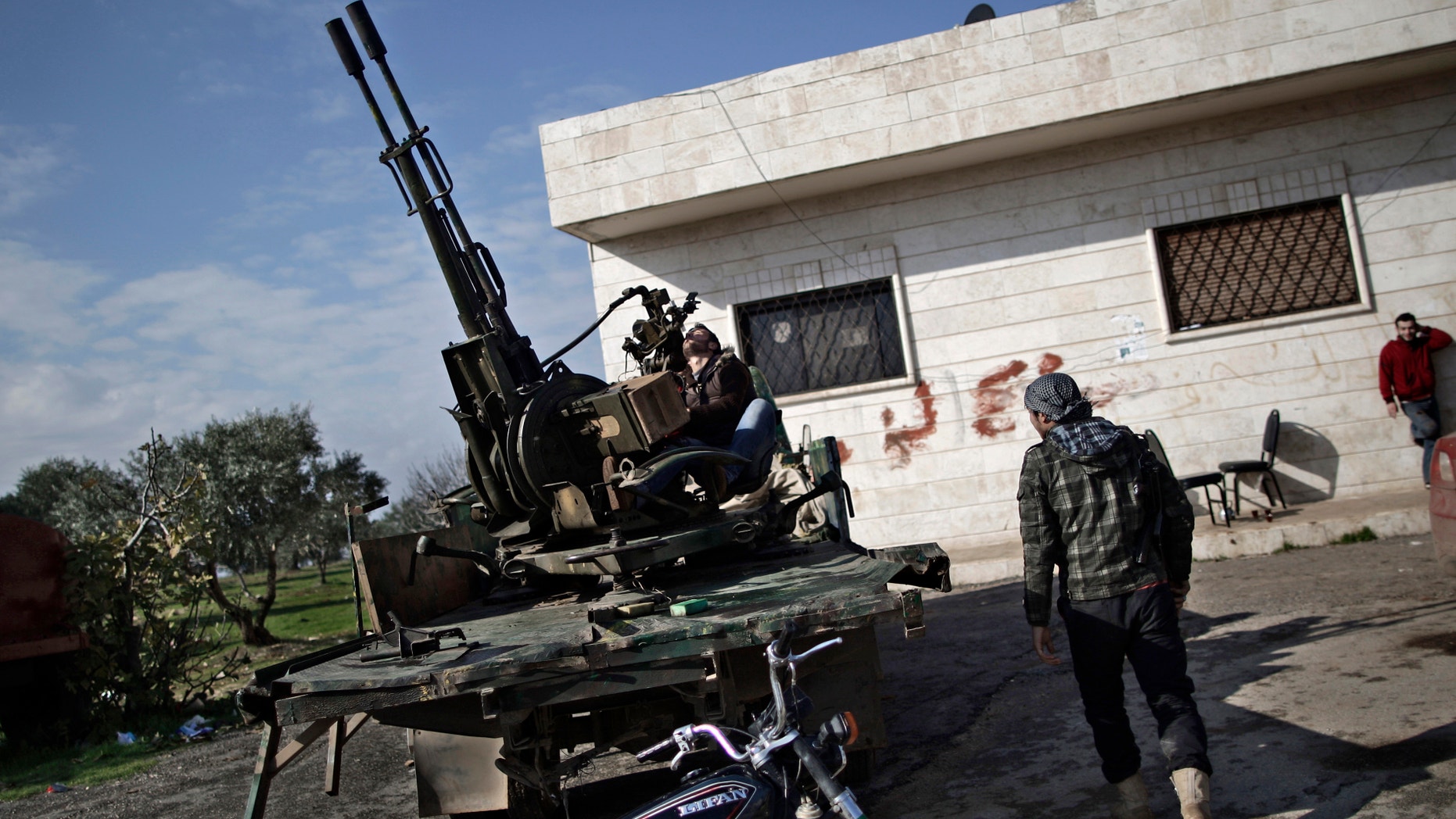 Dec. 14, 2012 - Syrian rebel checks an anti-aircraft weapon, in Maaret Misreen, near Idlib, Syria.