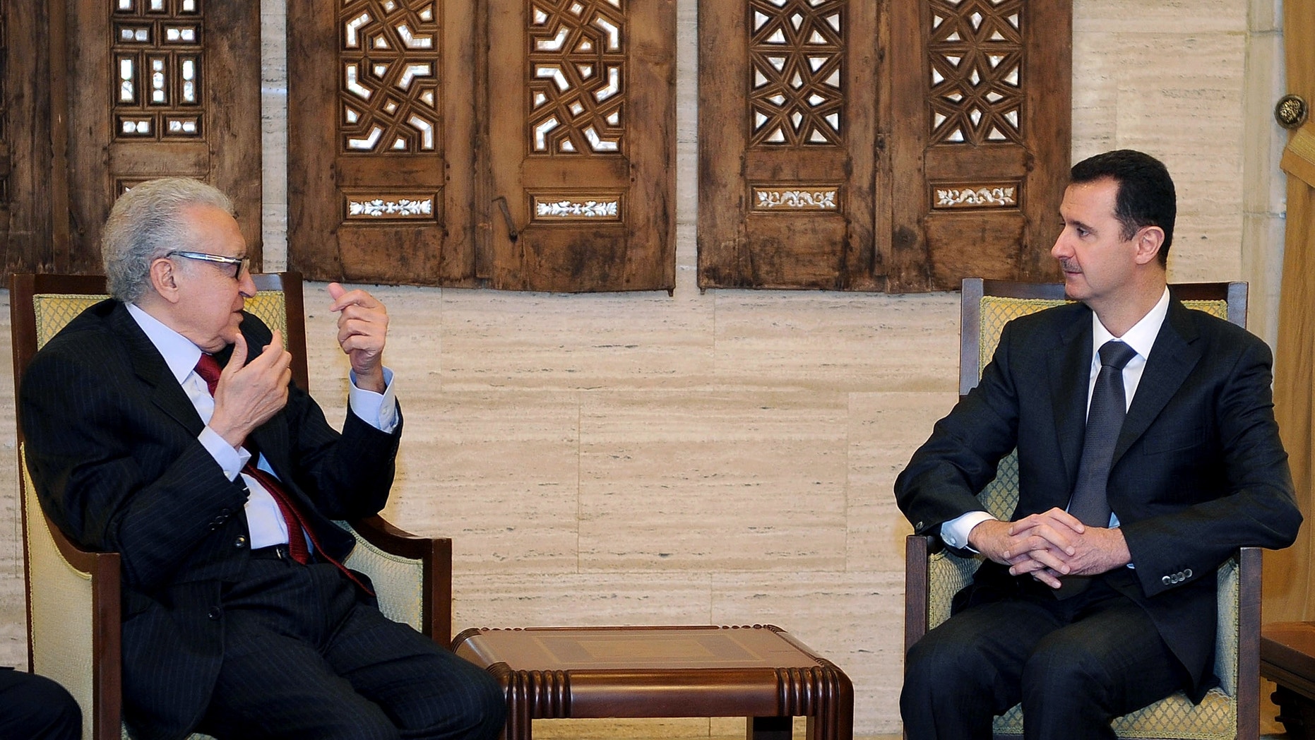 Dec. 24, 2012 - Syrian President Bashar al-Assad, right, meets with UN Arab League deputy to Syria, Lakhdar Brahimi in Damascus, Syria.