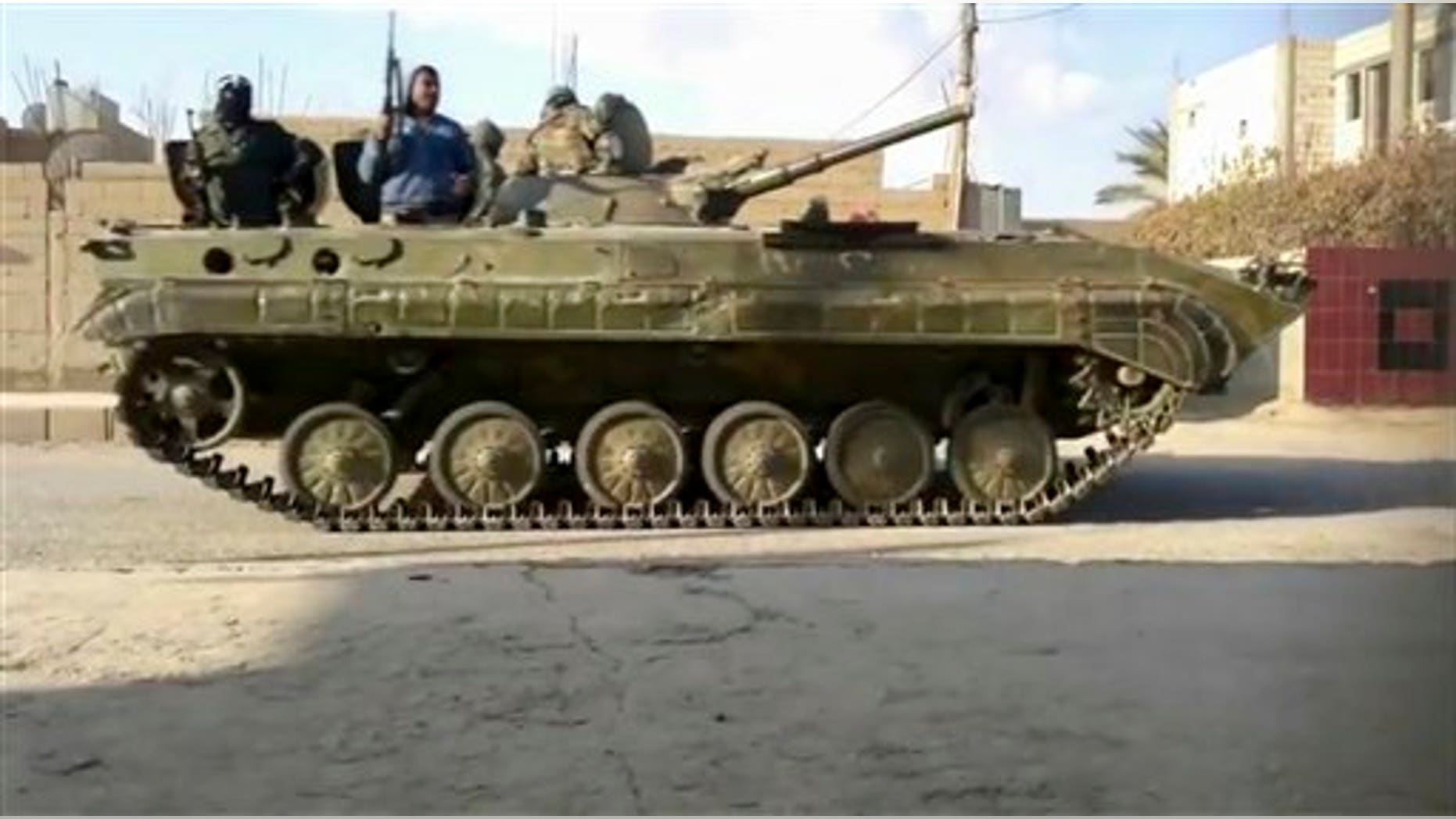 January 17, 2012: This image from amateur video made available by Shaam News Network purports to show a tank in Deir al-Zour, Syria.