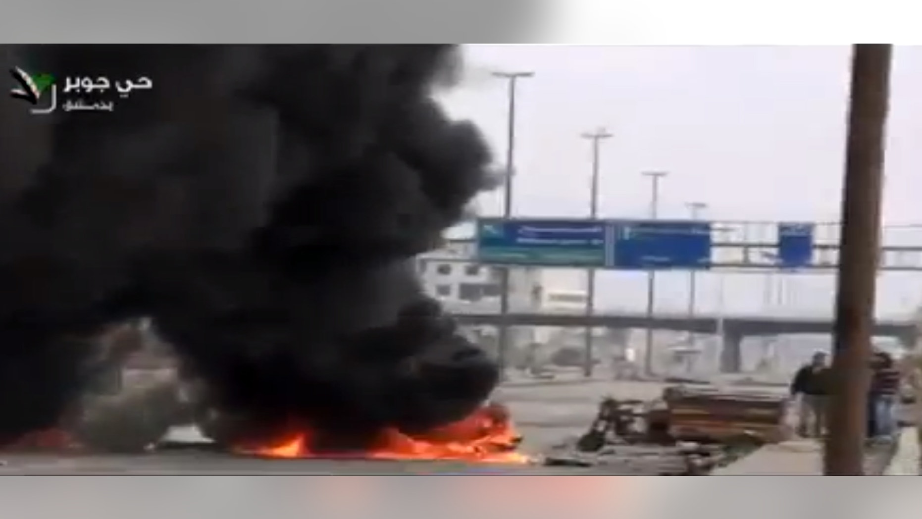 Feb. 8, 2013 - Image taken from video obtained from Ugarit News on Friday, shows smoke and fire rising on a main highway in Damascus, Syria.