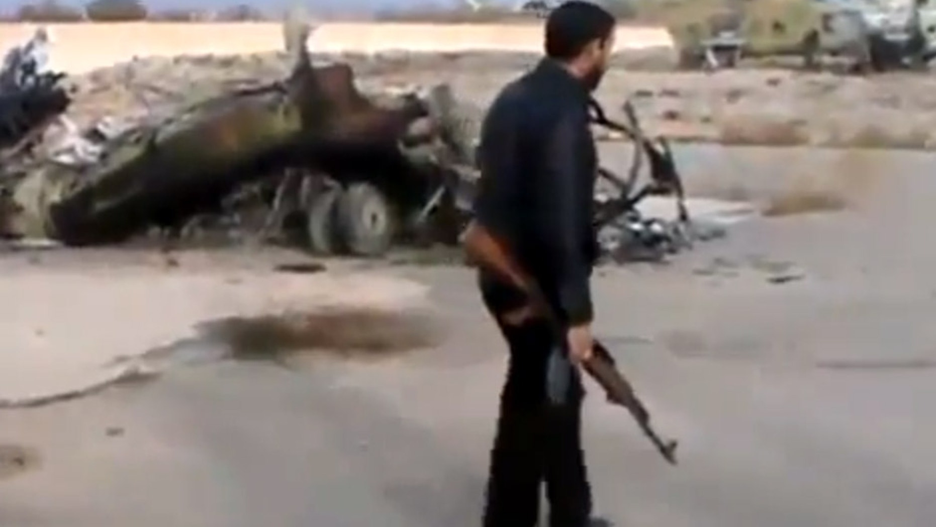 Nov. 25, 2012 - Image taken from video obtained from Ugarit News of Syrian rebels capturing a helicopter air base near the capital Damascus after fierce fighting in Syria.
