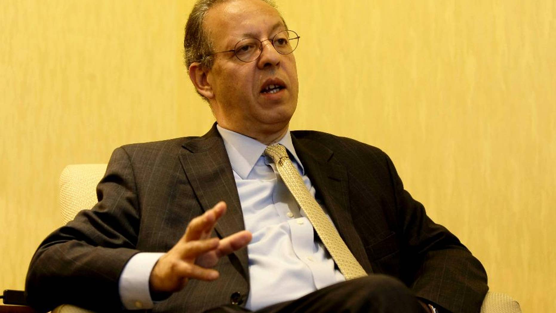 FILE - Assistant UN Secretary-General, Special Adviser to Secretary-General on Yemen, Jamal Benomar, speaks to a reporter during an interview with The Associated Press in Sanaa, Yemen, in this Nov. 18, 2013 file photo. The U.N.'s special envoy to Yemen has stepped down after four years of efforts at a peaceful political transition in the Arab world's poorest country fell apart amid a Shiite rebel uprising and Saudi-led airstrikes. A U.N. statement late Wednesday April 15, 2015 said Jamal Benomar "has expressed an interest in moving on to another assignment" and that his successor will be named "in due course." (AP Photo/Hani Mohammed, File)