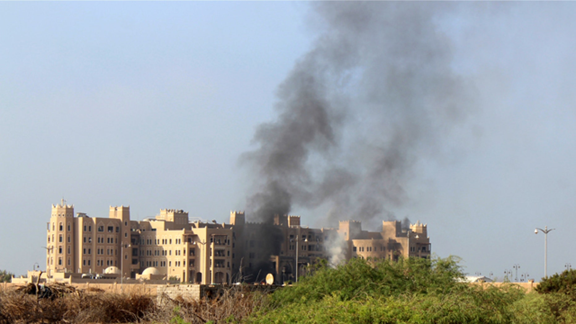 Oct. 6, 2015: Smoke rises following an explosion that hit Hotel al-Qasr where Cabinet members and other government officials are staying, in the southern port city of Aden, Yemen. Security officials, who work for Yemen's internationally recognized government said three explosions have hit Aden and there are casualties in Tuesday's explosions but they had no specifics or details. (AP Photo/Wael Qubady)