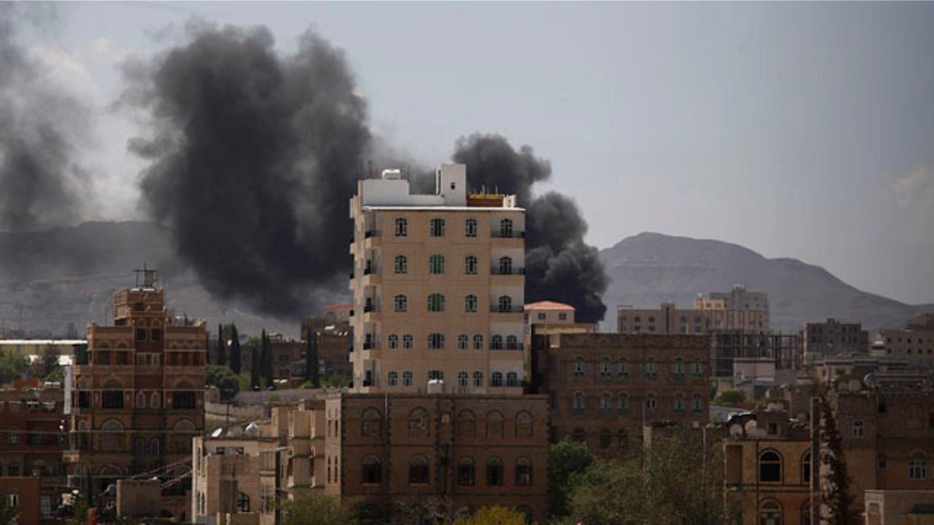 September 21, 2014: Smokes rises from an area during clashes between Sunni militiamen and Hawthi Shiite rebels in Sanaa, Yemen. (AP Photo/Hani Mohammed)