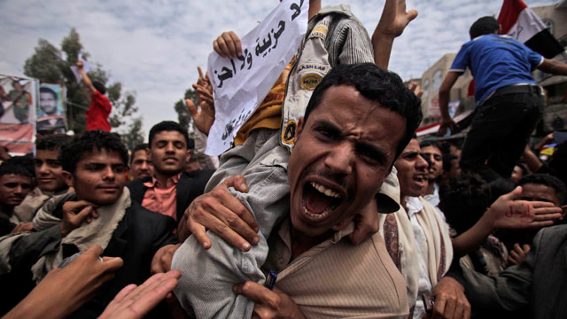 March 13, 2011: An anti-government protestor shouts during a demonstration demanding the resignation of Yemeni President Ali Abdullah Saleh, in Sanaa, Yemen.