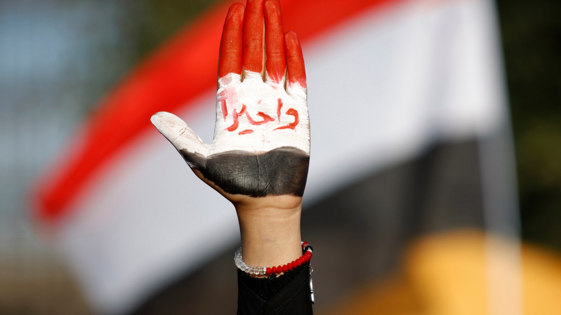 Dec. 20, 2012 - Female protestor displays her hand painted with Yemen's flag & Arabic reading "finally!" during a rally supporting president Abed Rabbu Mansour Hadi, in Sanaa, Yemen.