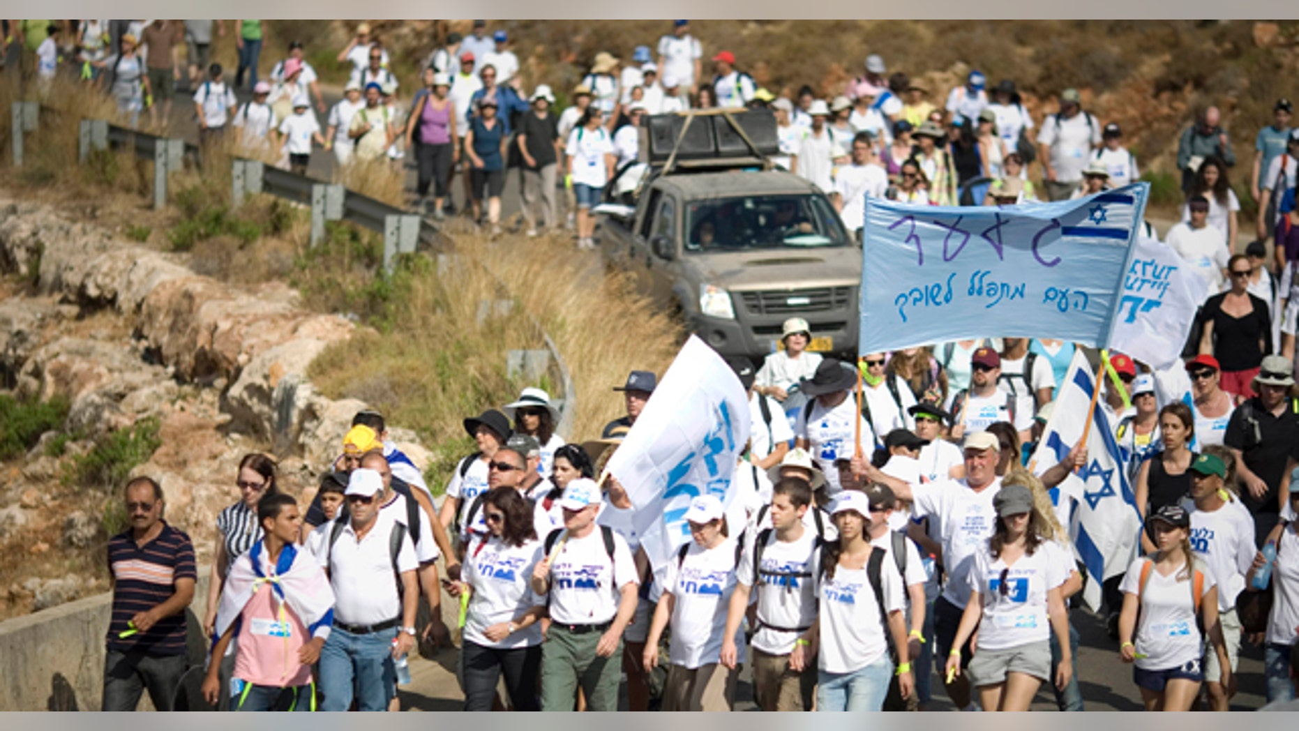 June 27: Family members of Israeli captured soldier Sgt. Gilad Schalit and their supporters march near Schalit's home in Mitzpe Hila, northern Israel. (AP)