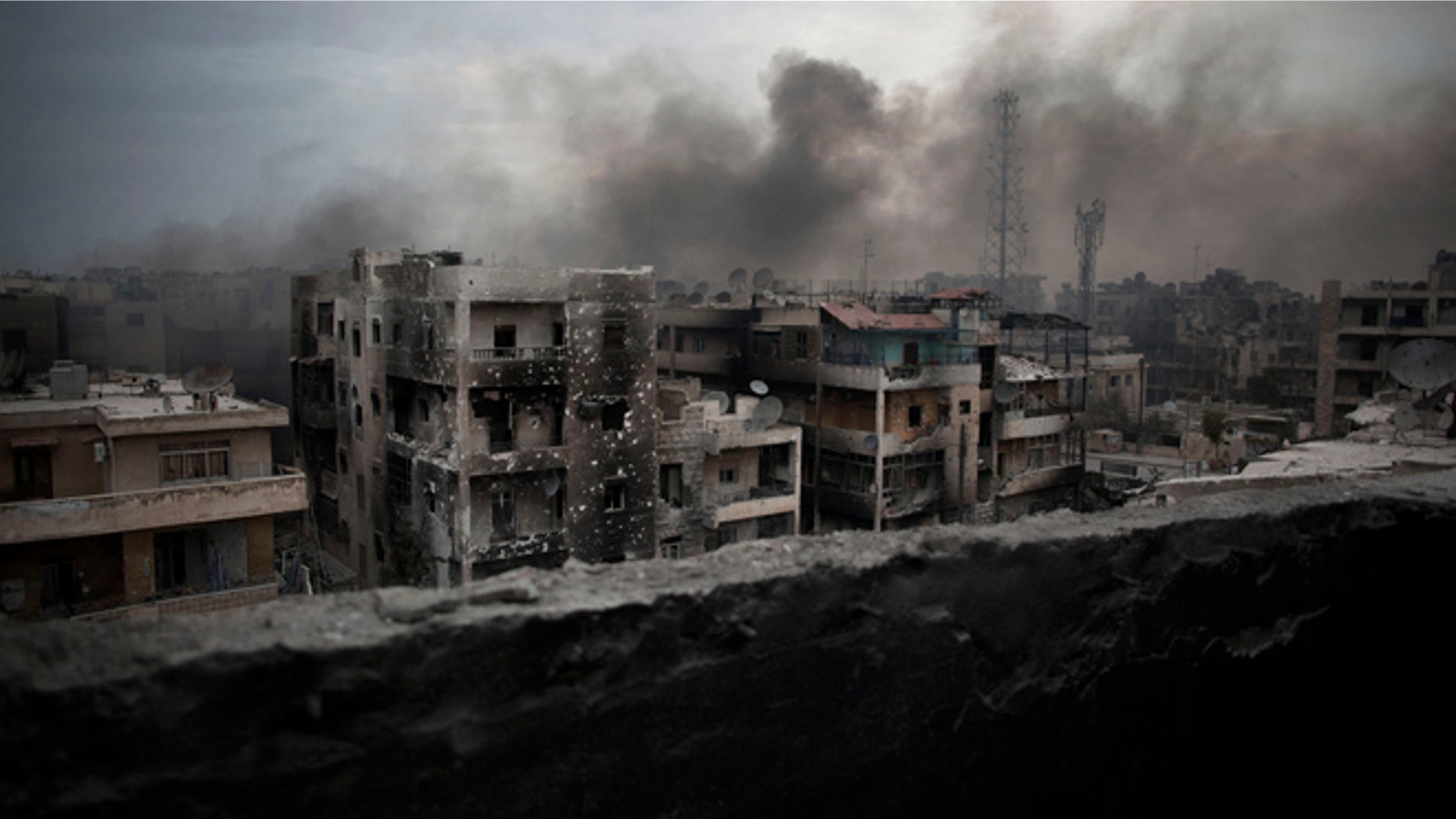 Oct. 2, 2012: Smoke rises over Saif Al Dawla district, in Aleppo, Syria.