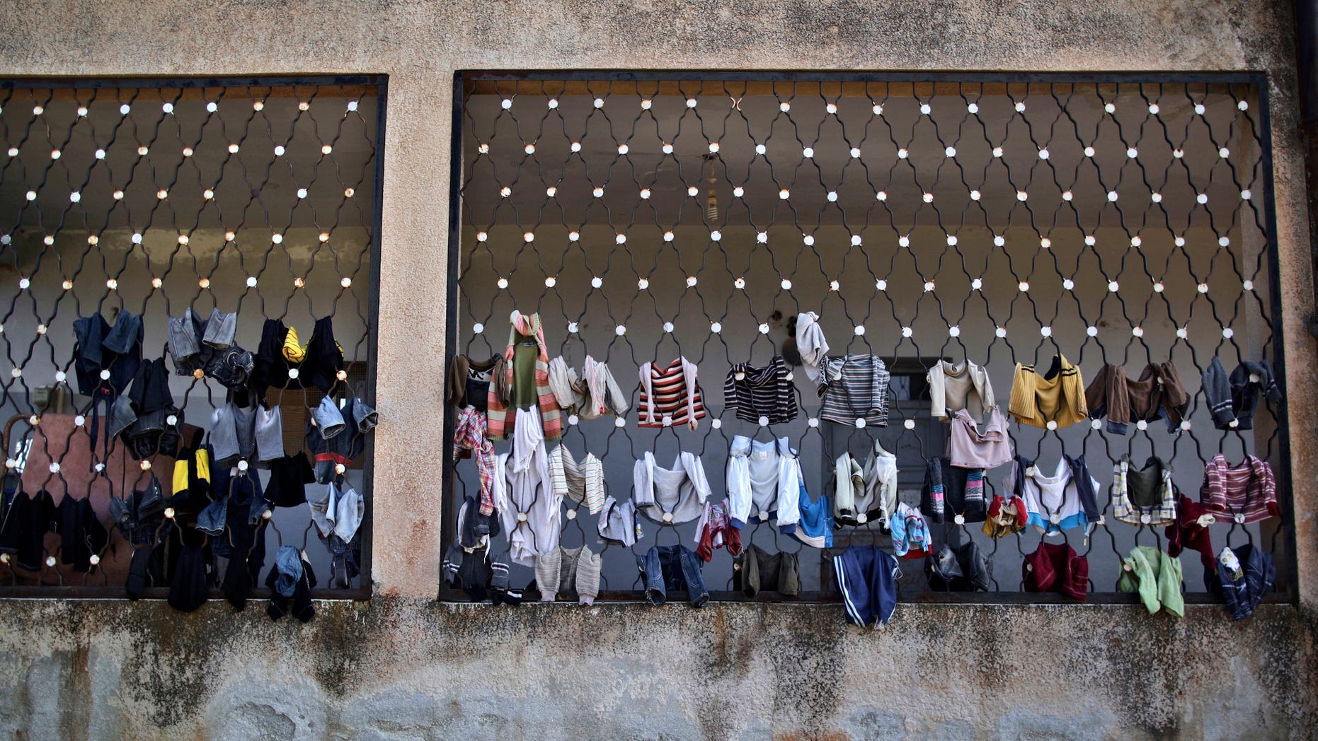 Dec. 14, 2012: Laundry belongs to Syrian children who fled their homes with their families due government airstrikes, are hung on a school where they are taking refuge, in Maaret Misreen, near Idlib, Syria.