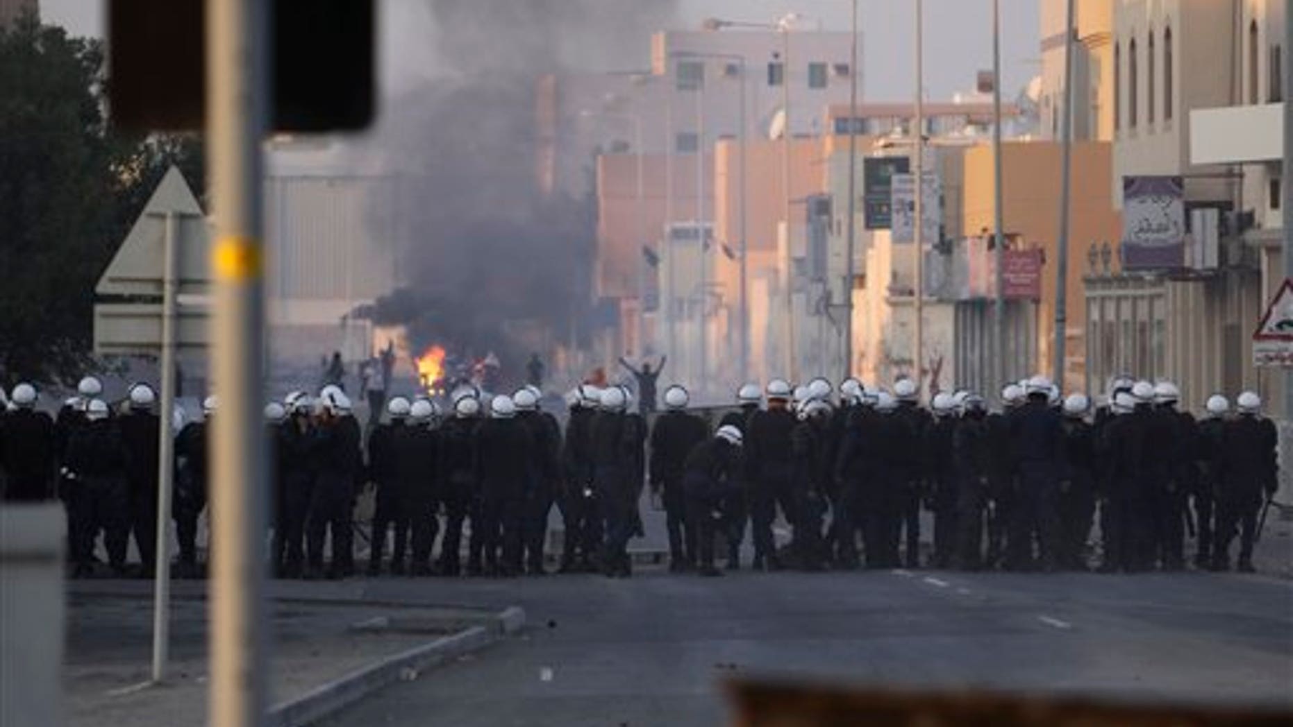 Jan. 1, 2012: Riot police and Bahraini anti-government protesters face off in the Shiite Muslim village of Sitra.