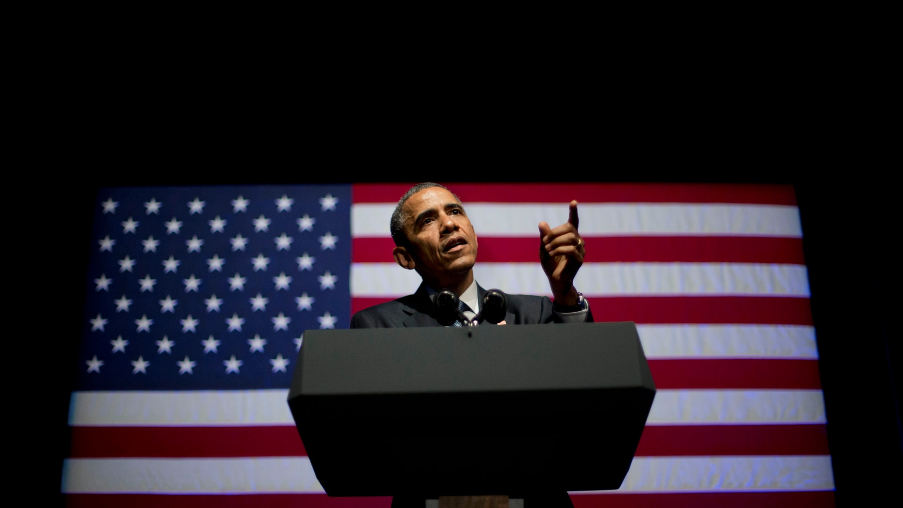 FILE - This June 17, 2014, file photo shows President Barack Obama speaking at the Democratic National Committee's (DNC) annual Lesbian, Gay, Bisexual and Transgender (LGBT) fundraiser gala in Gotham Hall, in New York. His name won't be on the ballot, but Obama will shape the midterm elections like no other. For Republicans, he is a punch line who fires up conservatives and reaches dissatisfied independents. And some Democrats won't even mention his name. It's left Obama able to do little more than raise money ahead of an election that will define how he spends his final two years in office. (AP Photo/Pablo Martinez Monsivais, File)