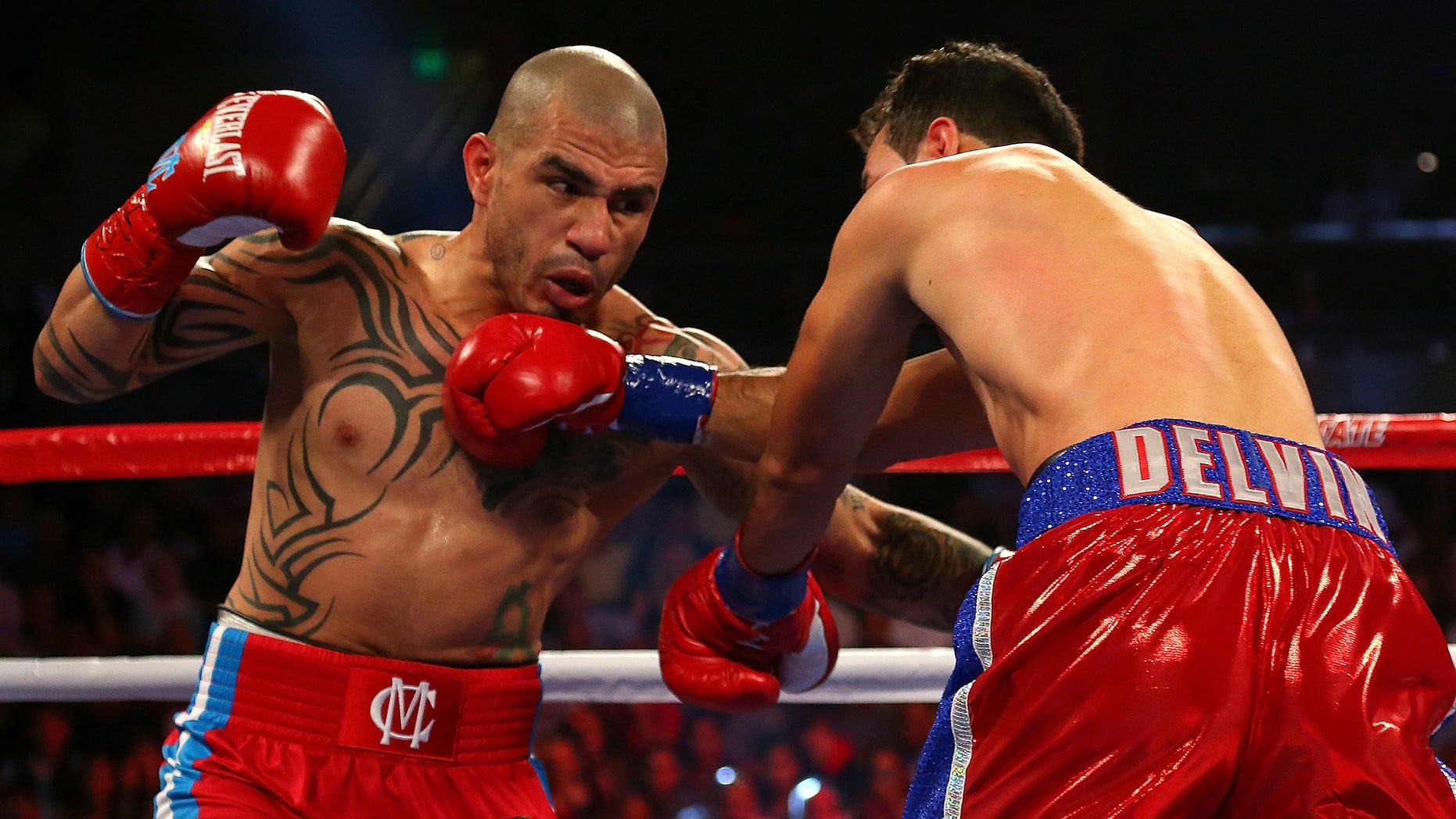 ORLANDO, FL - OCTOBER 05: Miguel Cotto throws a punch against Delvin Rodriguez during a Super Welterweight bout at Amway Center on October 5, 2013 in Orlando, Florida. (Photo by Mike Ehrmann/Getty Images)