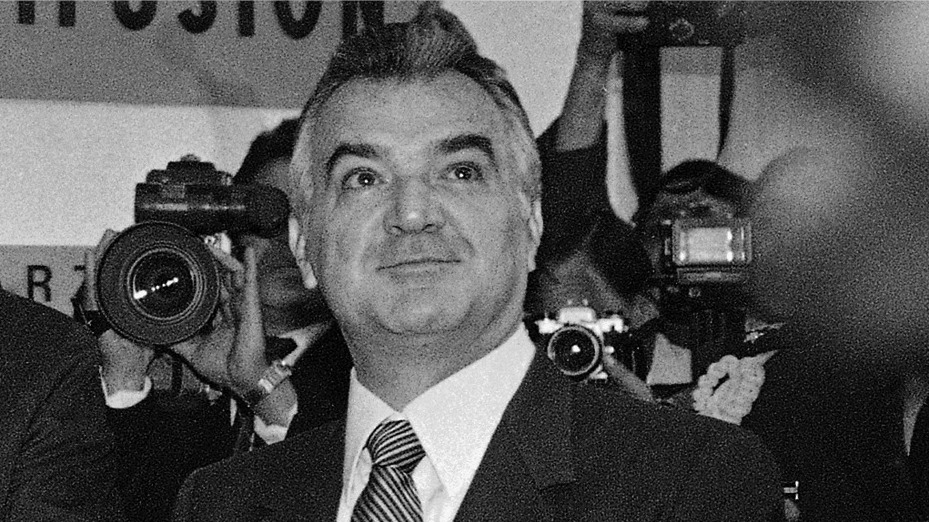 FILE - In this Dec. 13, 1985 file photo, former Mexican President Miguel de la Madrid applauds during the opening of the newly constructed press center for the 1986 World Cup soccer tournament in downtown Mexico City. De la Madrid, who led Mexico from 1982 to 1988, died Sunday April 1, 2012 at age 77, Mexico's President Felipe Calderon announced on his Twitter account. (AP Photo, File)