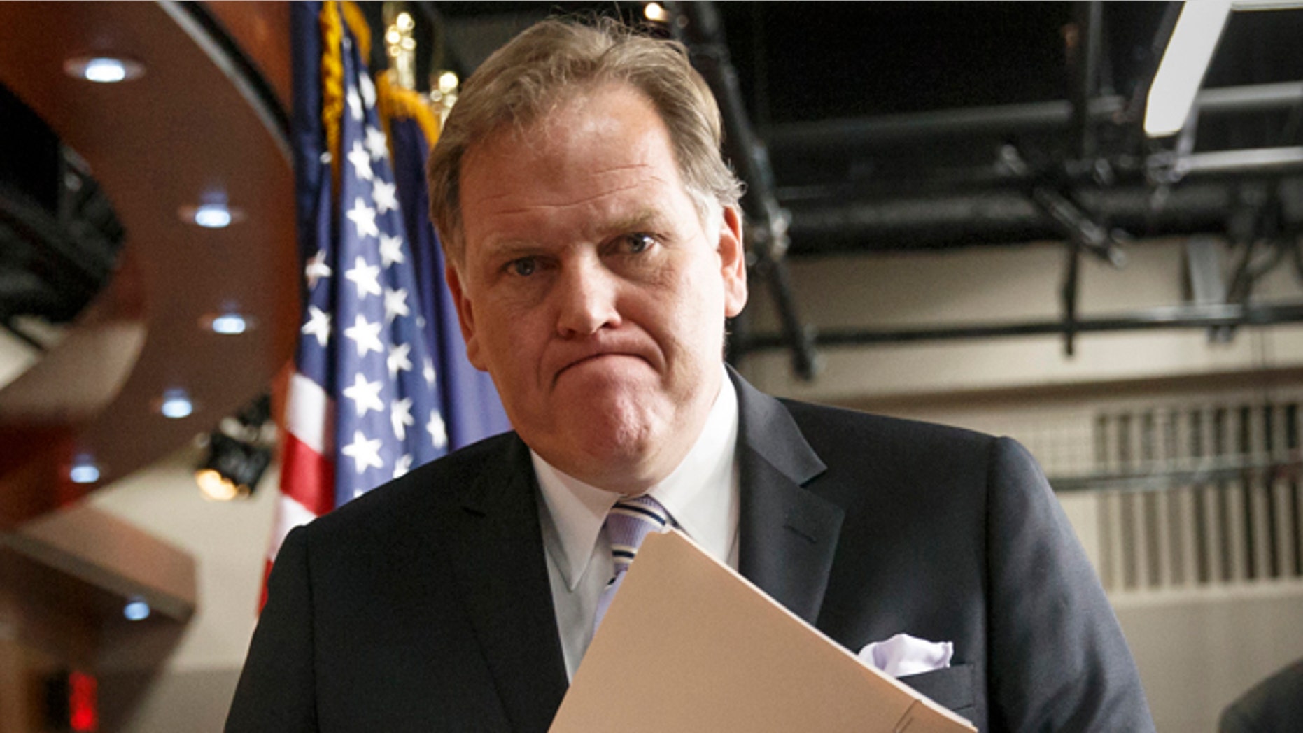 This March 25, 2014 file photo shows House Intelligence Committee Chairman Mike Rogers, R-Mich., leaving a press conference on Capitol Hill in Washington.