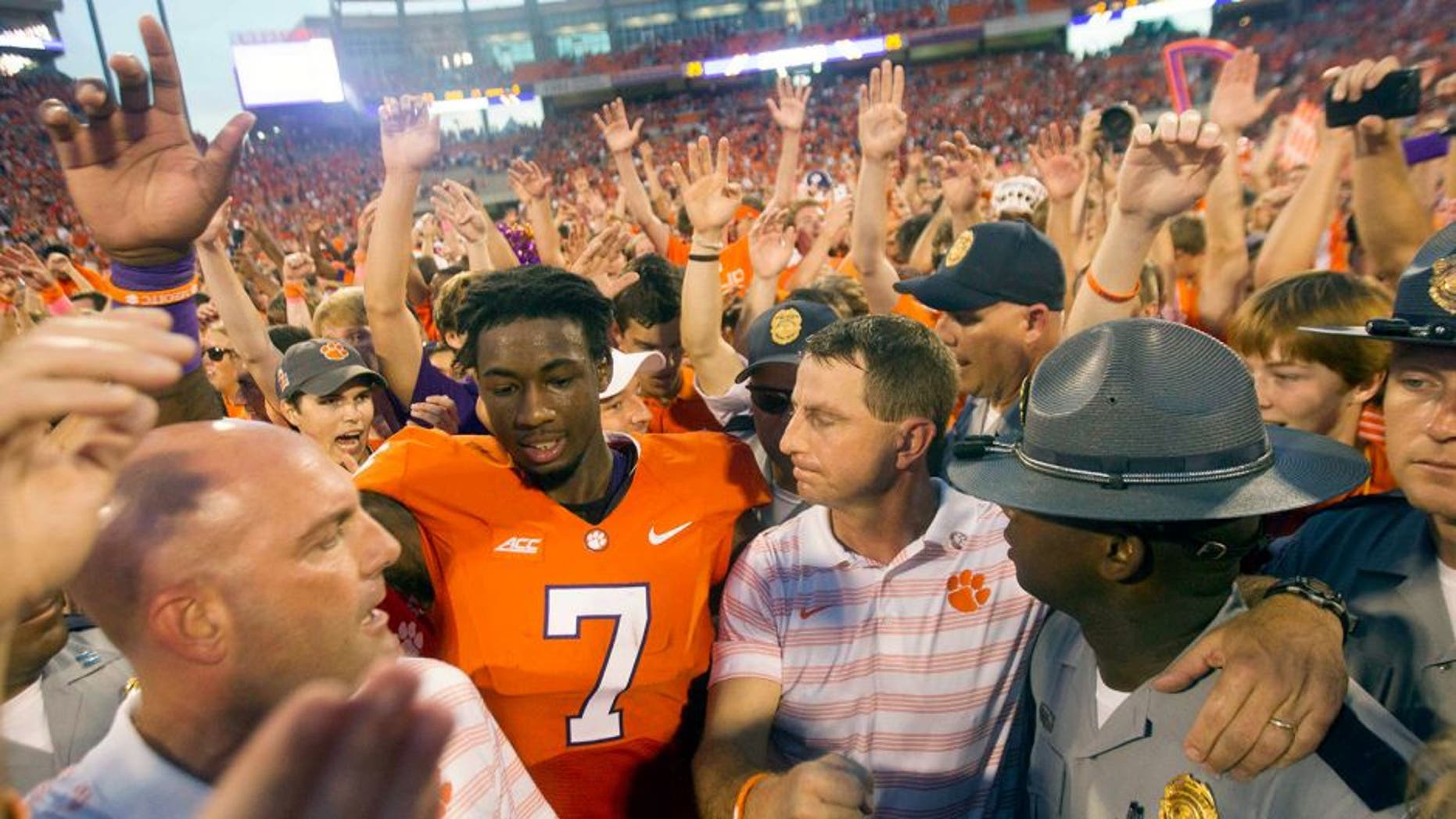 Oct 11, 2014; Clemson, SC, USA; Clemson Tigers wide receiver Mike Williams (7) celebrates with head coach Dabo Swinney (center right) after the game against the Louisville Cardinals at Clemson Memorial Stadium. Tigers won 23-17. Mandatory Credit: Joshua S. Kelly-USA TODAY Sports