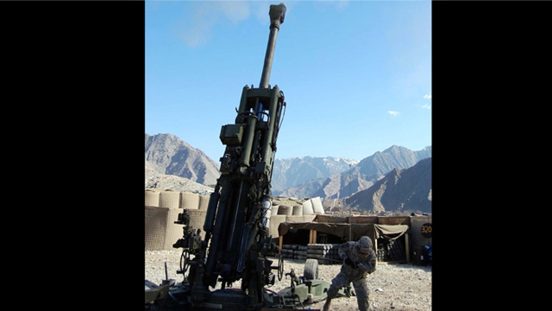 In this Feb. 25, 2008 photo, Pvt. Corey Rodriguez pulls the lanyard on the M-777A2 during the first firing of the Army's new GPS-guided Excalibur artillery round. A software glitch that temporarily left as many as 10,000 military GPS receivers unable to lock on to satellite locator signals showed how dependent the U.S. military has become on the Global Positioning System.