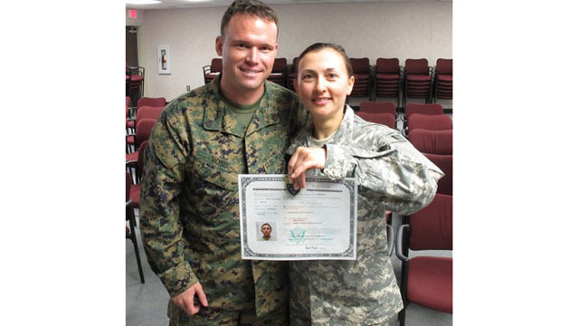 March 16: Army Spc. Rima Rusnac poses with her fiance, Staff Sgt. Ian Voss, after taking the oath to become a U.S. citizen, at Fort Jackson, S.C.