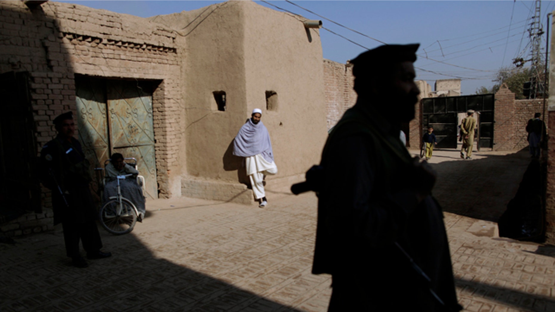Dec. 9, 2010: Pakistani militants guard their headquarters in Peshawar, Pakistan.
