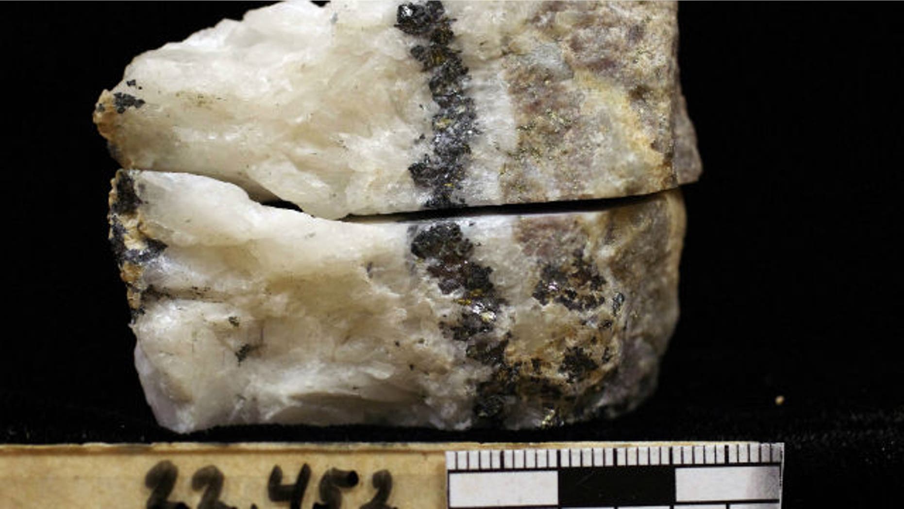 A rock sample being analyzed in a Denver laboratory consisting of quartz, fine grain (microscopic) pyrite, galena and sphalerite.