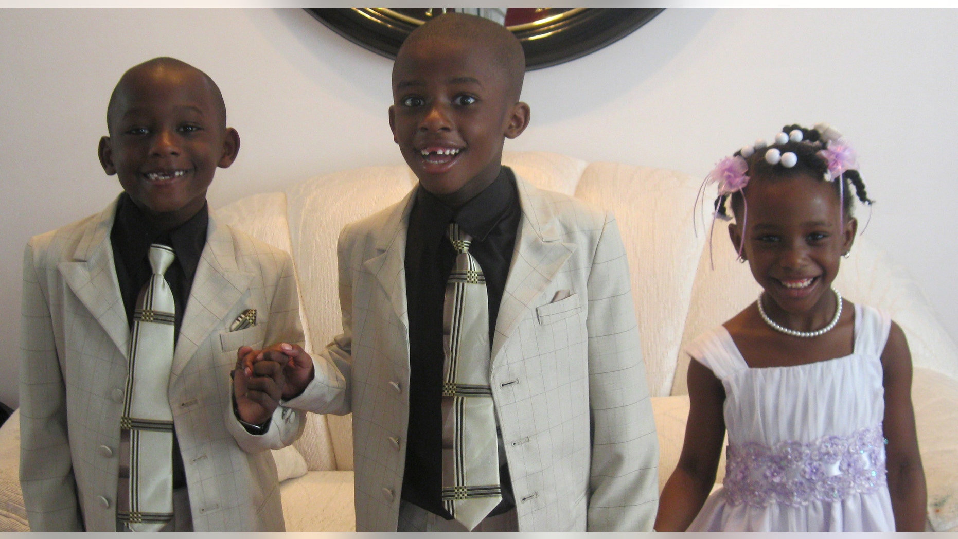 This April 24, 2011 handout photo provided by the Lemon family shows Matthew Lemon, center, accompanied by his brother Joshua and sister Victoria in Randallstown, Md. Early diagnosis is considered crucial for autism, but studies show minority children are diagnosed later than white children. Some new work is beginning to finally uncover why _ and to raise awareness of the warning signs that can be evident even in the toddler years. Matthew was diagnosed with autism at age 2, and his mother Marlo Lemon says he was lucky to have begun treatment for developmental delays even sooner. Early diagnosis is considered key for treating autism, but research suggests minority children tend to be diagnosed later and may have more severe symptoms than their white counterparts. (AP Photo/Lemon Family)