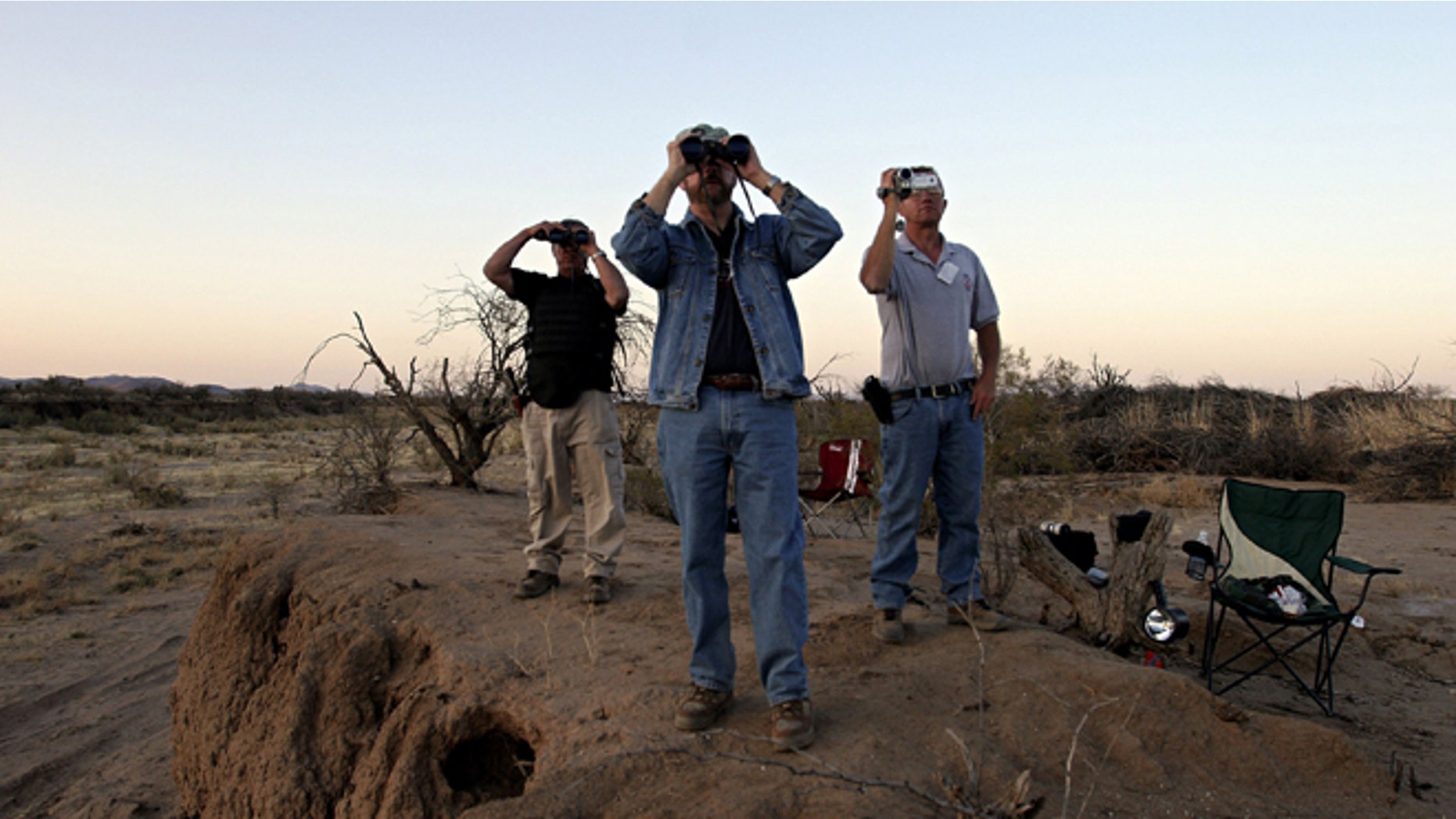 THREE POINTS, AZ - APRIL 1: (L-R) Minutemen Tony Ford, Vic Roman and Jeff Almli continue to search for a group of 12 undocumented immigrants after Roman spotted them from their post in the Altar Valley April 1, 2006 in the Sonoran Desert 35 miles south of Tucson, Arizona. Roman reported sighting the immigrants who were later captured by the Border Patrol. Approximately 100 volunteers from several states came to Arizona to participate in the third month-long action near the U.S. and Mexican borders searching for those entering the country illegally. Minutemen will also be stationed near the border with California, New Mexico and Texas. Chris Simcox, the leader of the Arizona Minutemen announced that there are now 7,000 registered Minutemen throughout the U.S. (Photo by Jeff Topping/Getty Images)