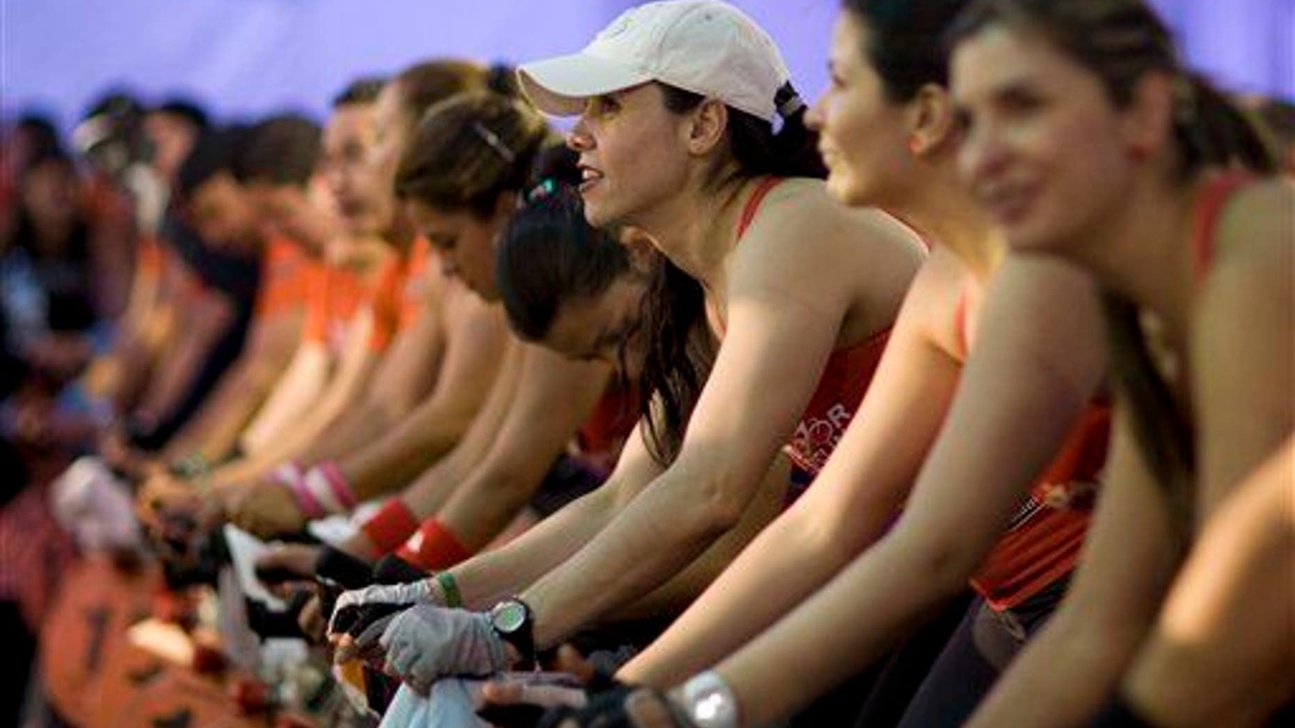 Riders pedal during a spinning marathon.