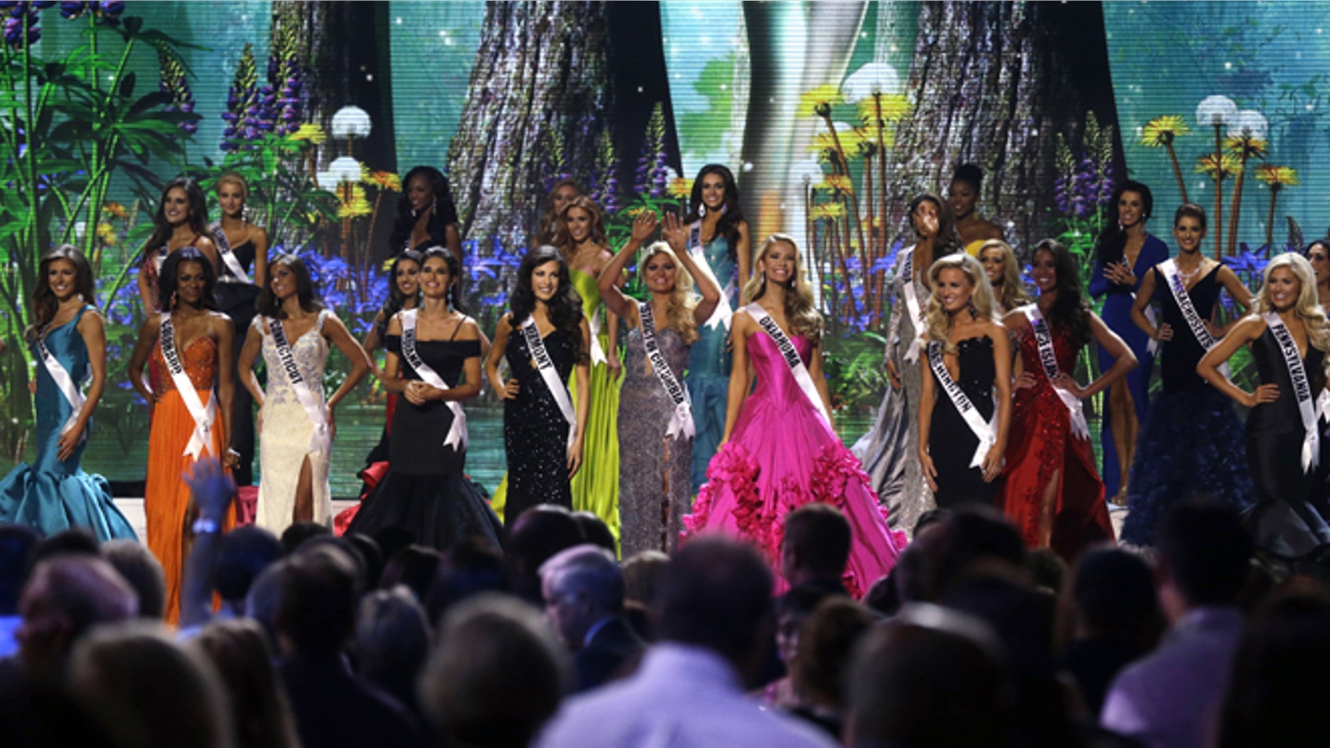 Contestants wave onstage at the conclusion of the preliminary round of the 2015 Miss USA Pageant in Baton Rouge, La., Wednesday, July 8, 2015. (AP Photo/Gerald Herbert)