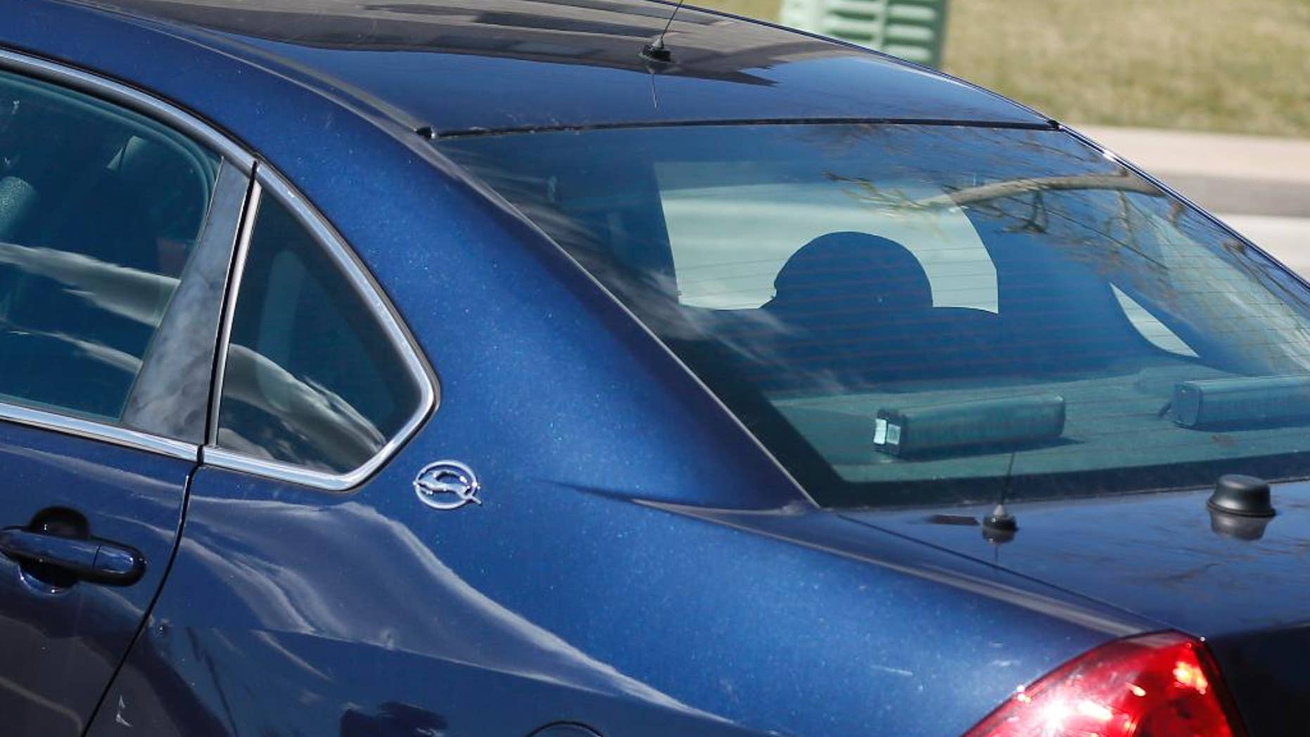 Pierre Collins, the father of a 10-year-old boy whose body was found in the Mississippi River over the weekend, sits in teh back of a police vehicle after he was arrested Monday, April 13, 2015, and taken from his Cedarwood apartment in Crystal, Minn. Collins was arrested on suspicion of second-degree murder in the death of Barway Collins, Crystal Police Chief Stephanie K. Revering said in a news release. (Jerry Holt/Star Tribune via AP) MANDATORY CREDIT; ST. PAUL PIONEER PRESS OUT; MAGS OUT; TWIN CITIES LOCAL TELEVISION OUT