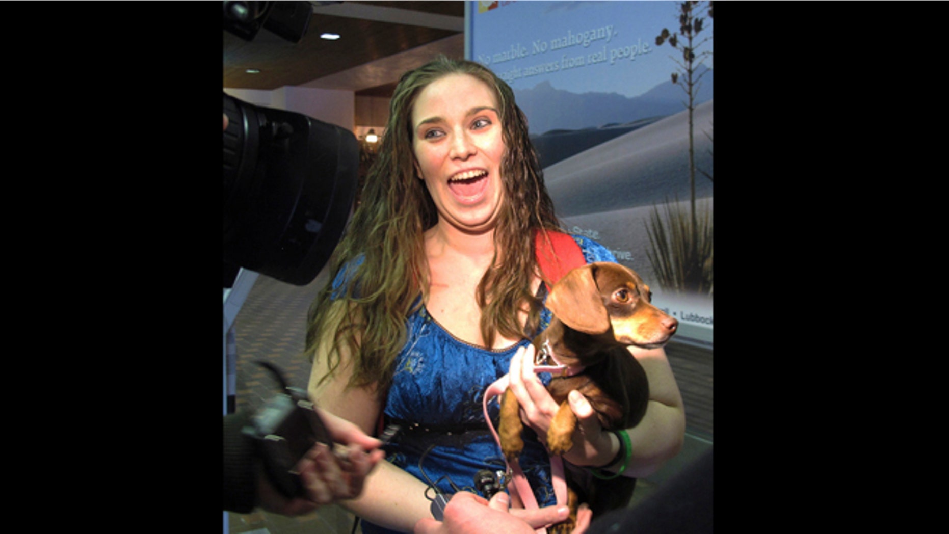 Jan. 30, 2013: Mandi Smith, of Fort Campbell, Ky., is reunited with her dog, Pooka at the Albuquerque International Sunport Airport in Albuquerque, N.M.