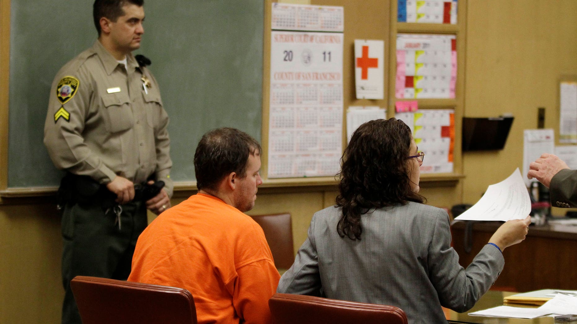Dec. 14: Jeffrey Scott Easley, center, accused of abducting 12-year-old Brittany Mae Smith of Virginia, looks on as his attorney Bicka Barlow, right, hands over his signed extradition waiver during a hearing at Superior Court in San Francisco.