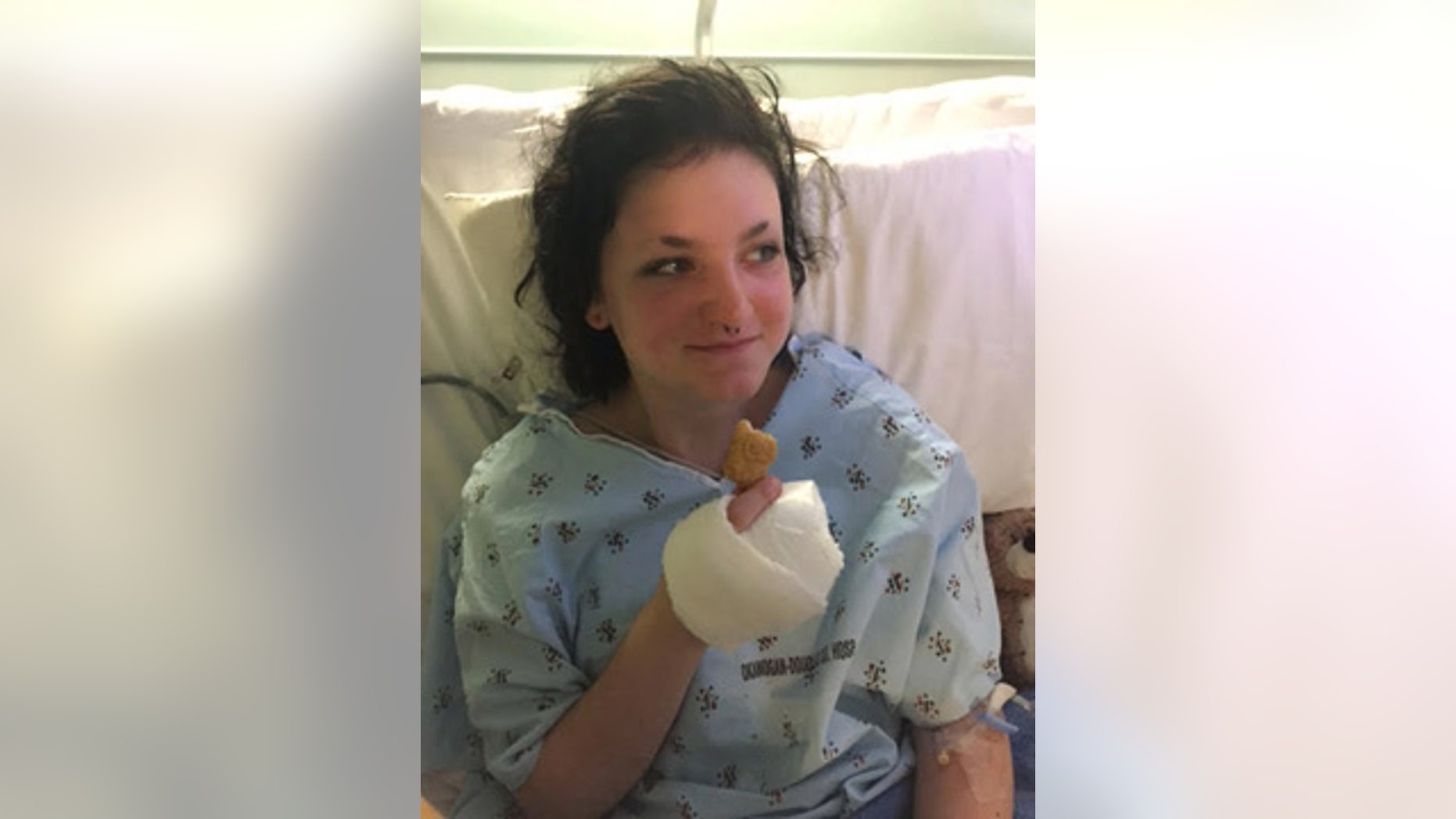 July 13, 2015: In this photo provided by family friend Sara Esperance, Autumn Vetch eats a meal of chicken nuggets at the Okanogan Douglas Hospital in Brewster, Wash. Veatch survived a plane crash Saturday that killed her step-grandparents and forced Veatch to hike her way through a rugged slope to safety. (Sara Esperance via AP)