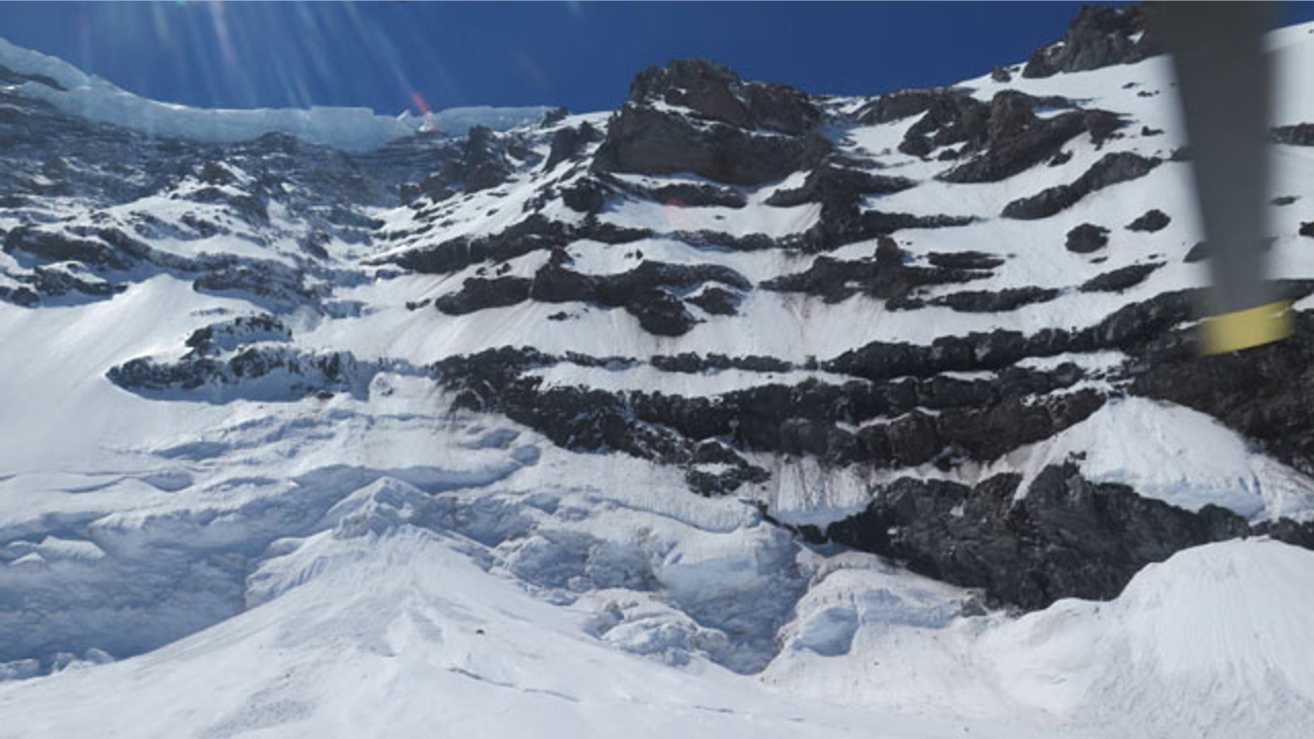 May 31, 2014: This photo provided by the National Parks Service, shows the Liberty Ridge Area of Mount Rainier as viewed from the Carbon Glacier. (AP Photo/National Park Service)