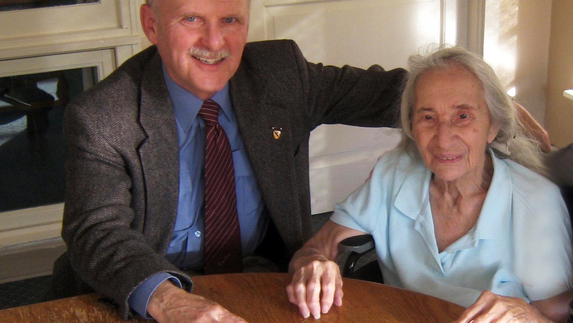 This November, 2012 photo provided by Jim Caccavo, left, shows him with his former neighbor Sarah Cheiker, then aged 89, in Freyberg, Maine. (AP/Courtesy Jim Caccavo)