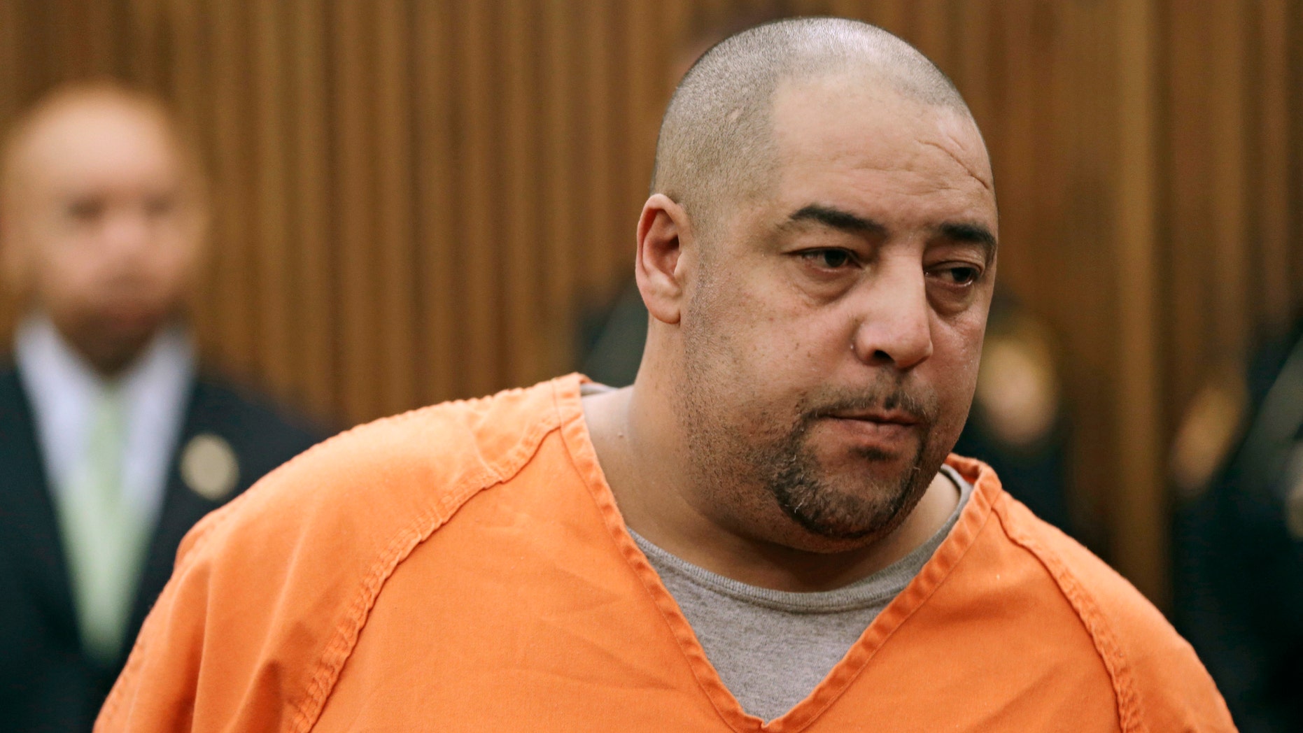 Elias Acevedo stands before a judge during his arraignment Monday, Oct. 21, 2013, in Cleveland.