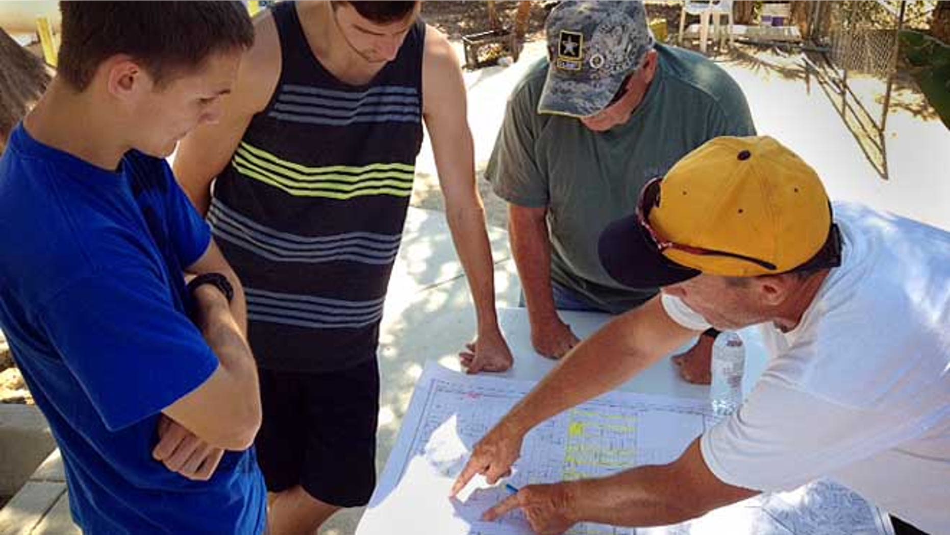 July 8, 2013: Searchers in Menifee, Calif., looking for Terry Dewayne Smith Jr., an 11-year-old autistic boy who has been missing from his Menifee for more than a day, check a map to coordinate search areas.