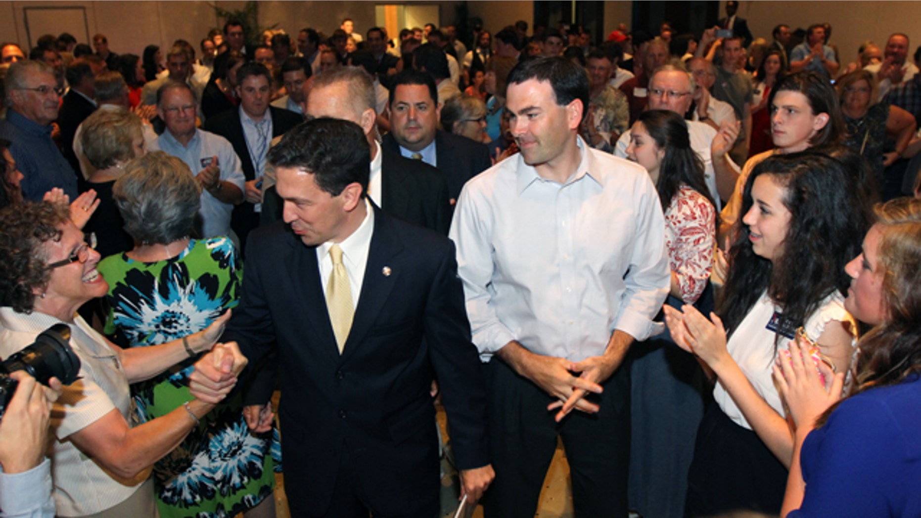 June 3, 2014: Chris McDaniel greets supporters as he heads to the podium to speak about his close race with incumbent U.S. Senator Thad Cochran during McDaniel's election night party at the Lake Terrace Convention Center in Hattiesburg, Miss. (AP Photo/George Clark)