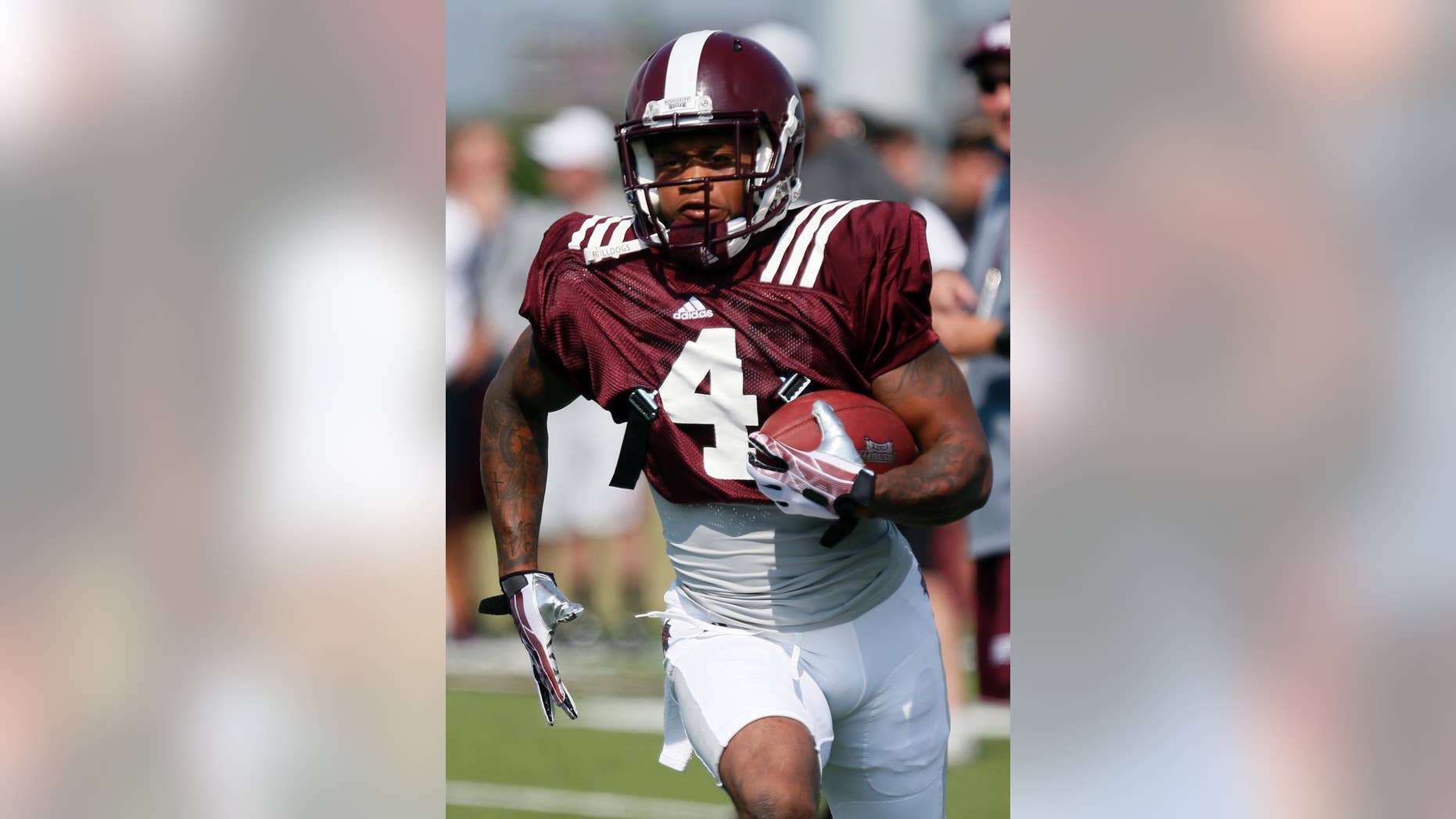 In this Aug. 2, 2014 photo, Mississippi State wide receiver Jameon Lewis runs upfield during a drill during NCAA college football practice in Starkville, Miss. Lewis was such a versatile playmaker last season that he accounted for a passing, rushing and receiving touchdown in the same game last season--twice. Now he's back, and the Bulldogs are still trying to find creative ways to use him (AP Photo/Rogelio V. Solis)