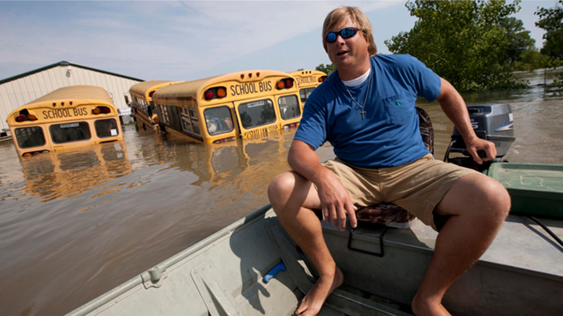 May 21: Chris Lynn checks his fathers property which is still surrounded by floodwaters from the Mississippi River in Vicksburg, Miss.