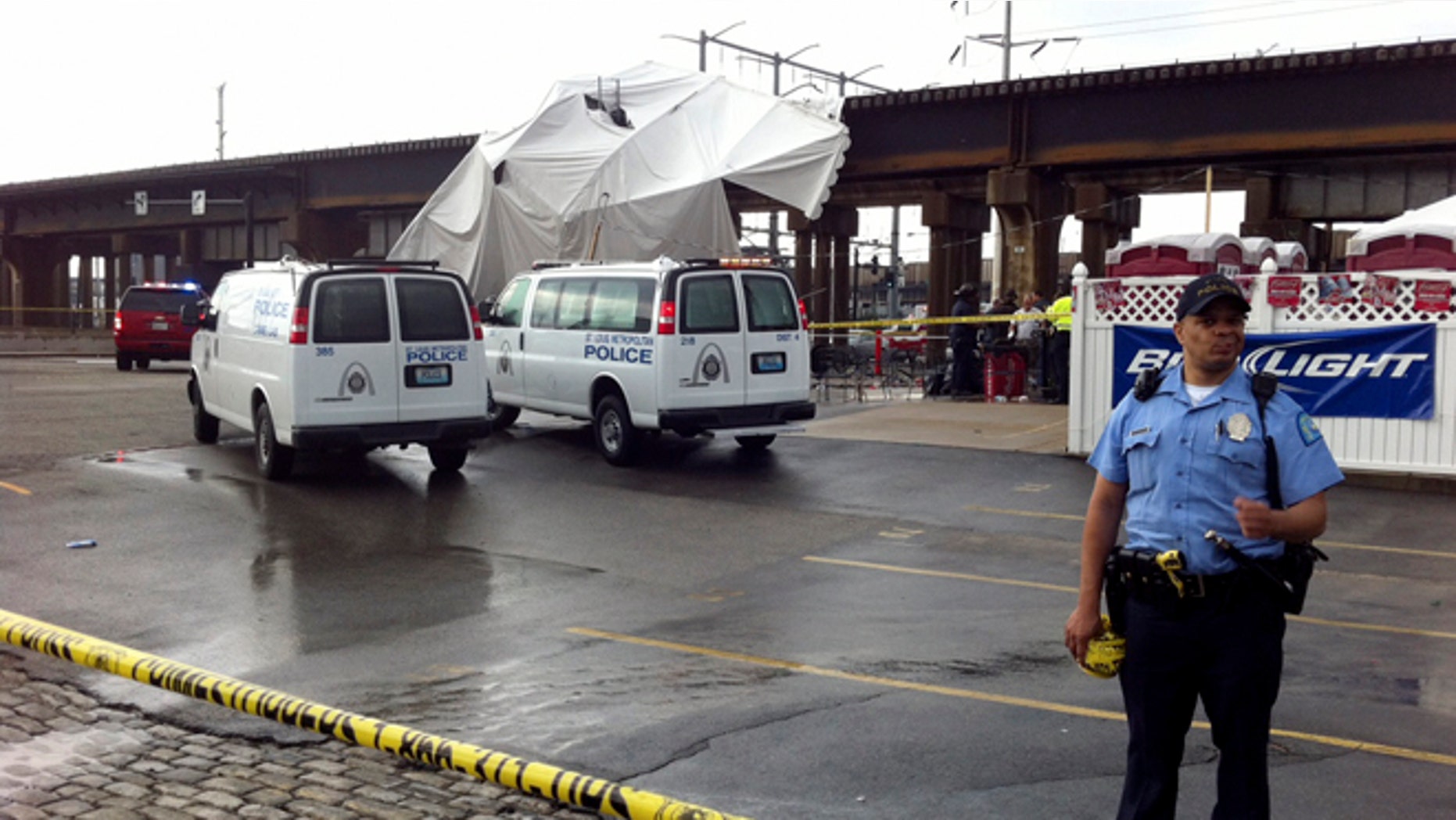 April 28, 2012: Officials respond to the scene where a tent blew over after high winds crossed the area in St. Louis.